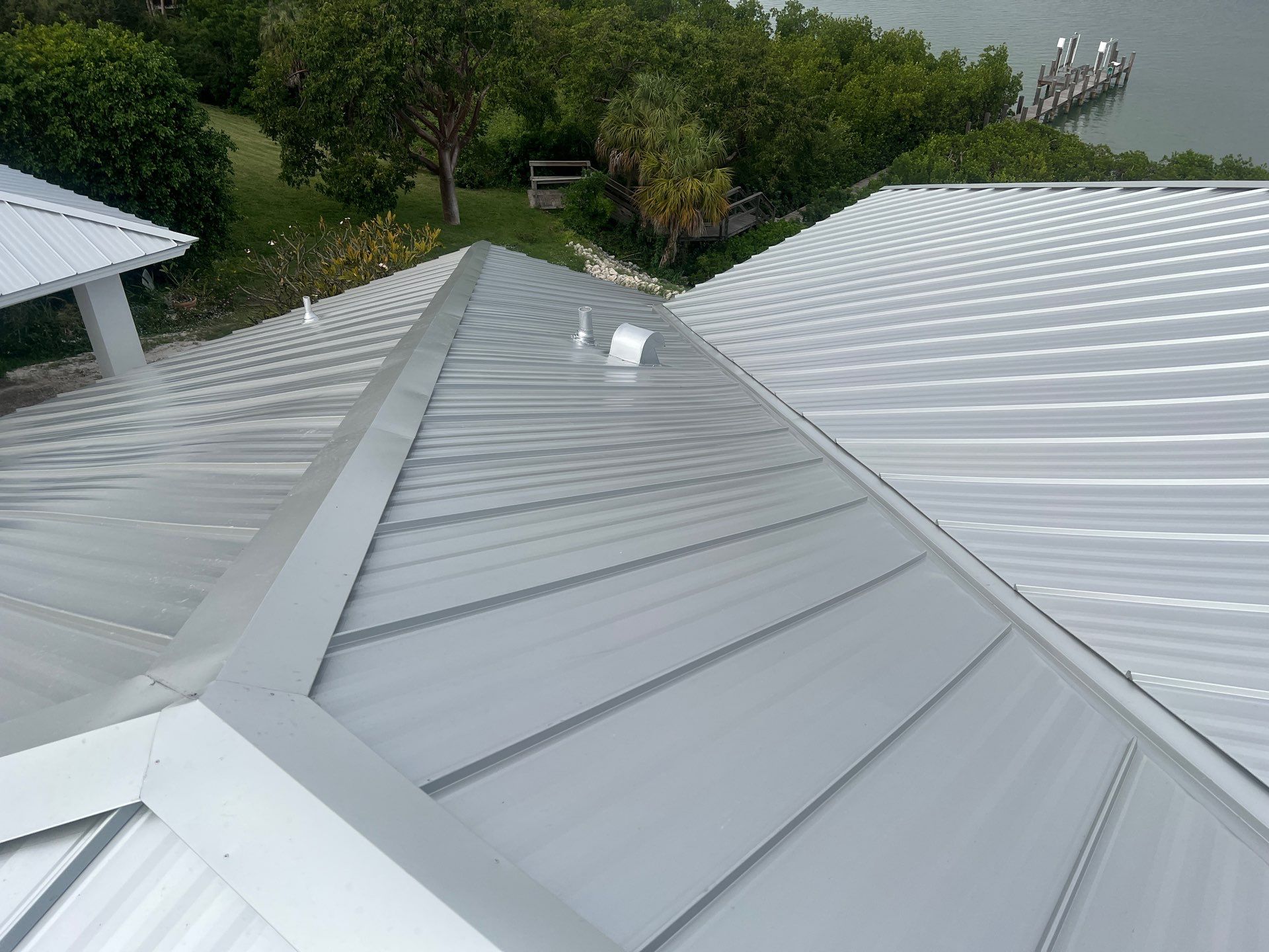 Residential Roofing Installation using Galvalume Standing Seam by Durabilis Roofing INC