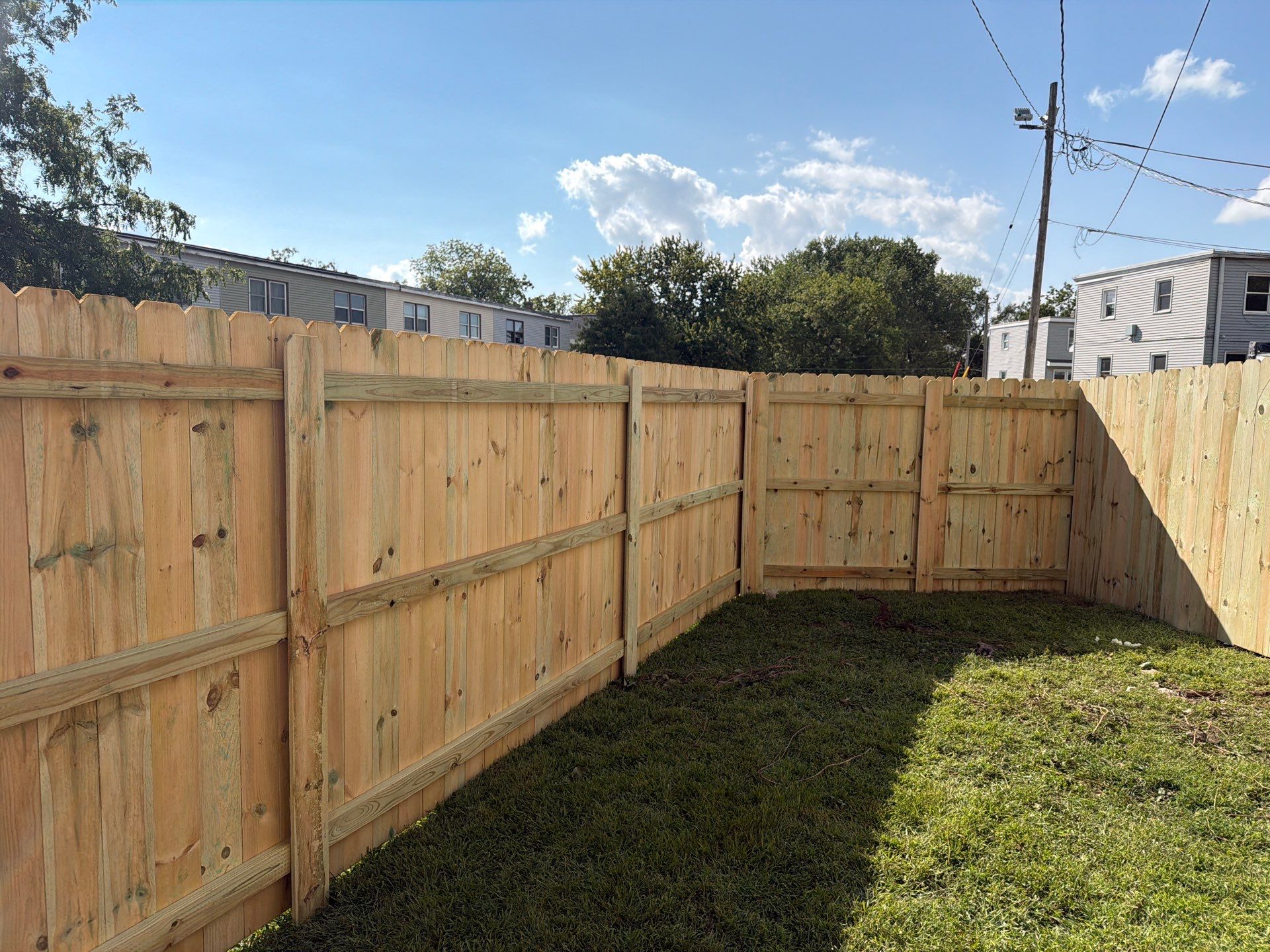 New Treated Wood Privacy Fence and Metal-Framed Gates by Perfect Picket Fence and Stain