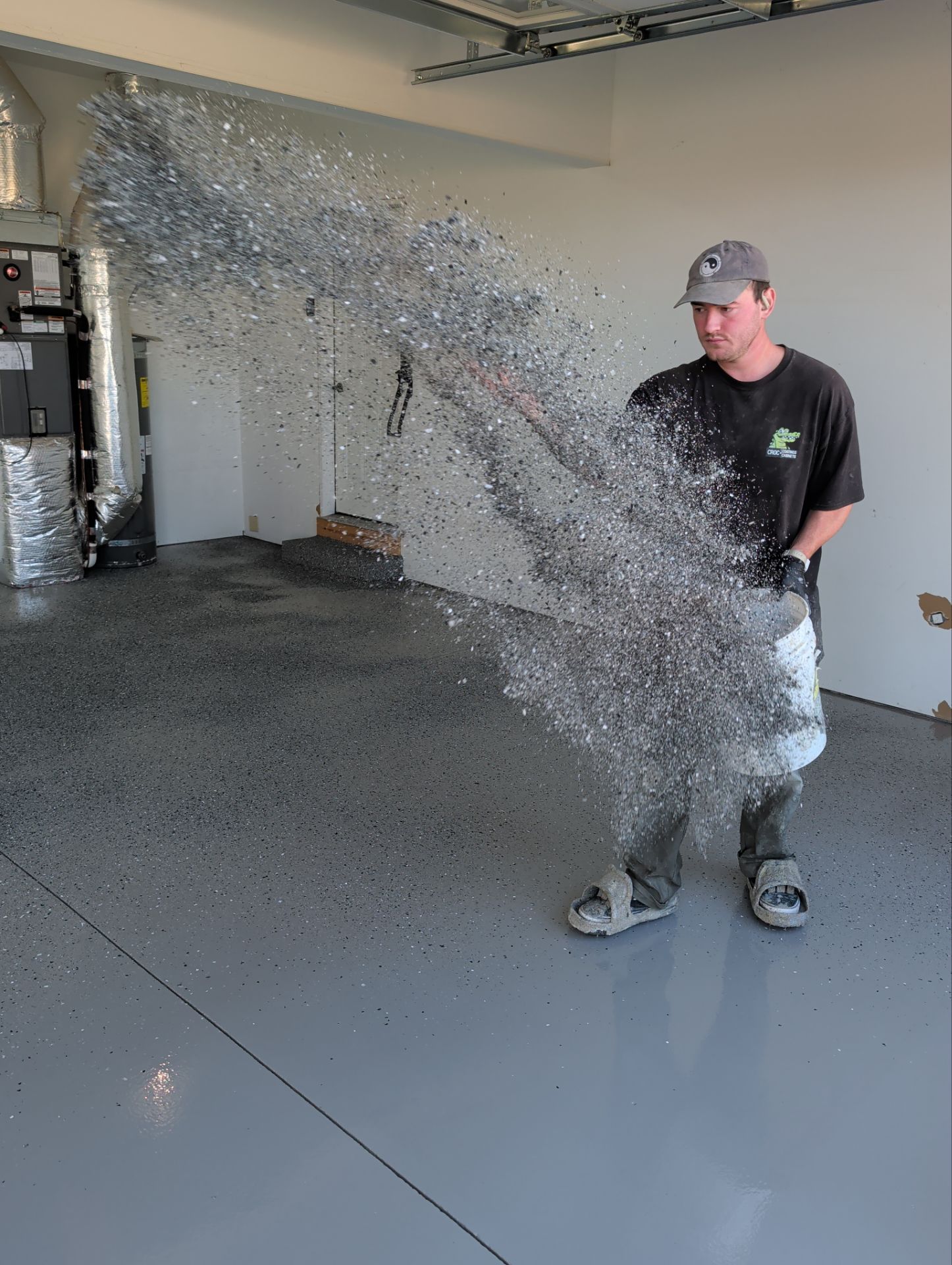 Polyaspartic Garage Floor Coating With Slate Hybrid Flake in Davenport by Croc Coatings, LLC
