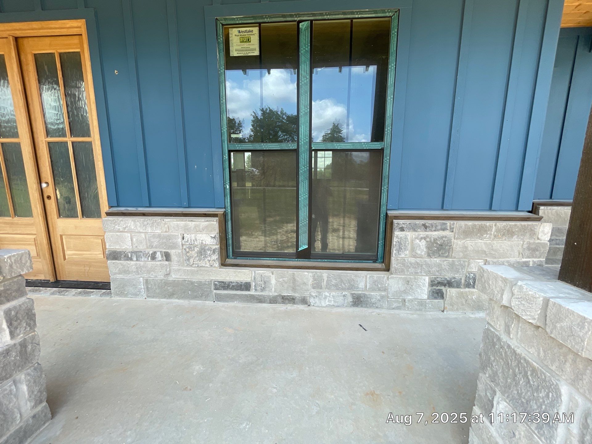 Natural Stone Elegance: Apex Installation Accented by Blue Siding by Apex Conventional Stucco Llc