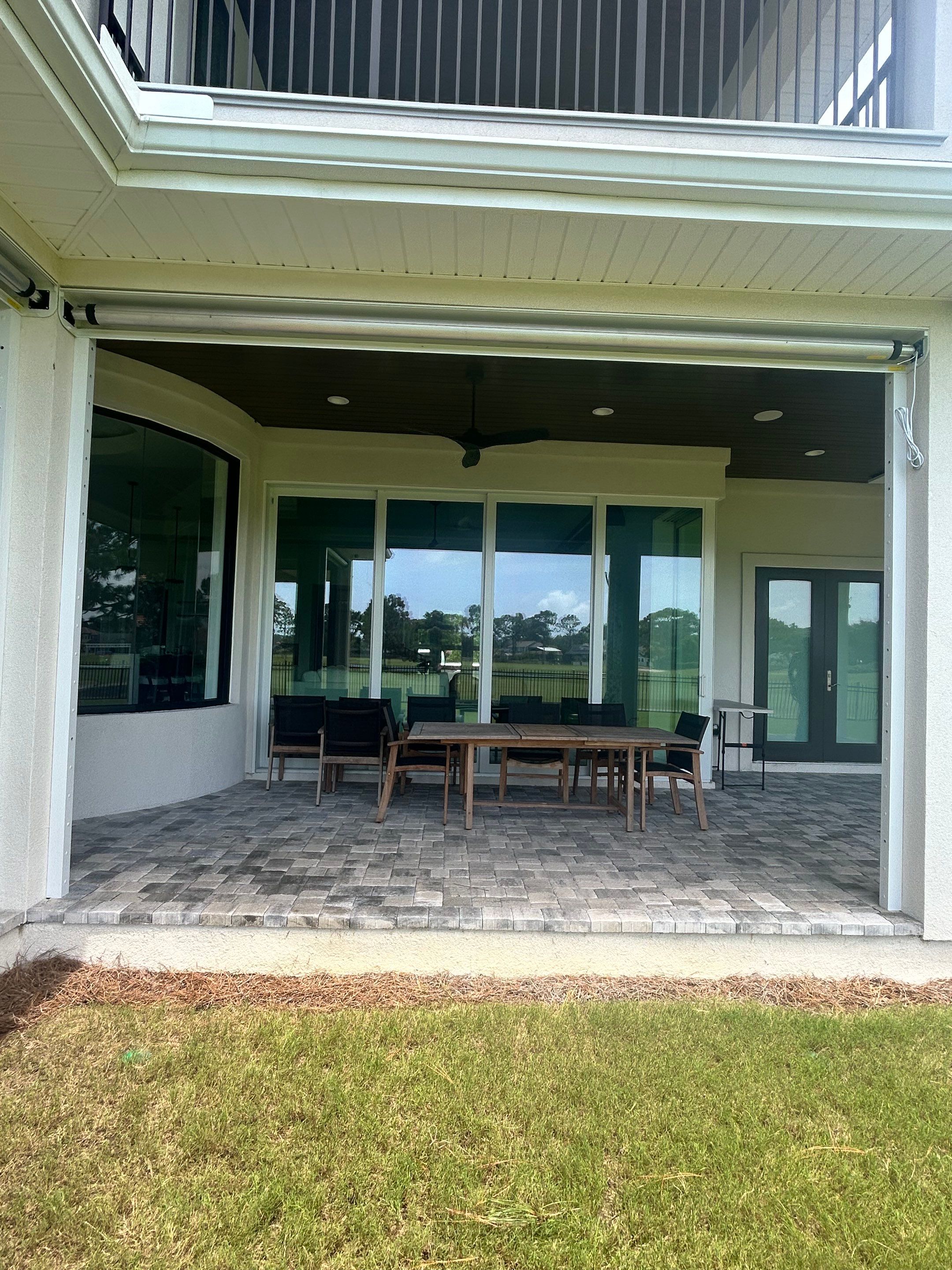 Motorized Screen and Solar Shade Installation in Panama City Beach by Brannan Aluminum Inc.