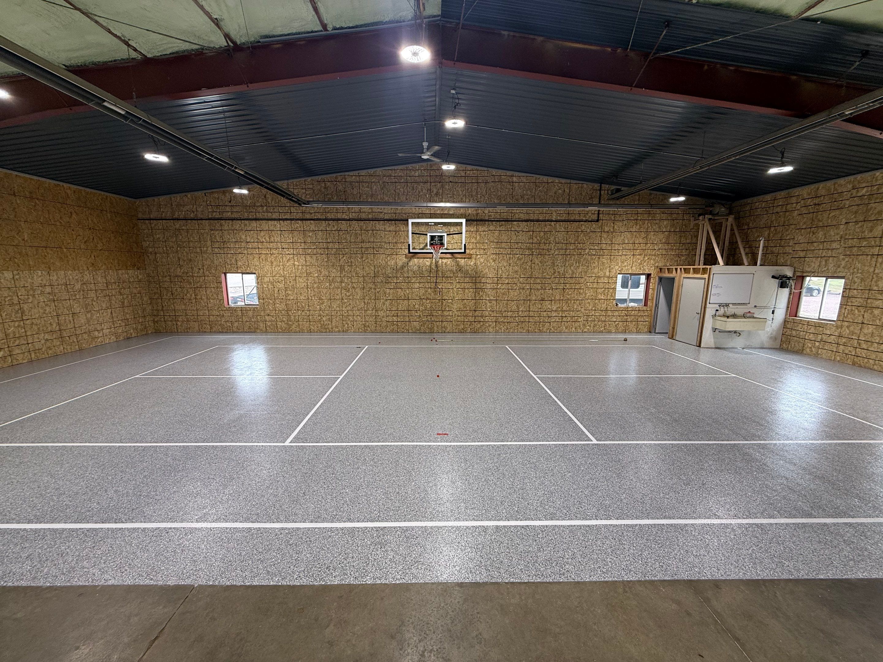 Custom Polyurea Shop Floor with Basketball Court Lines in Rock Valley by Select Painting, Coatings & Garage Cabinets