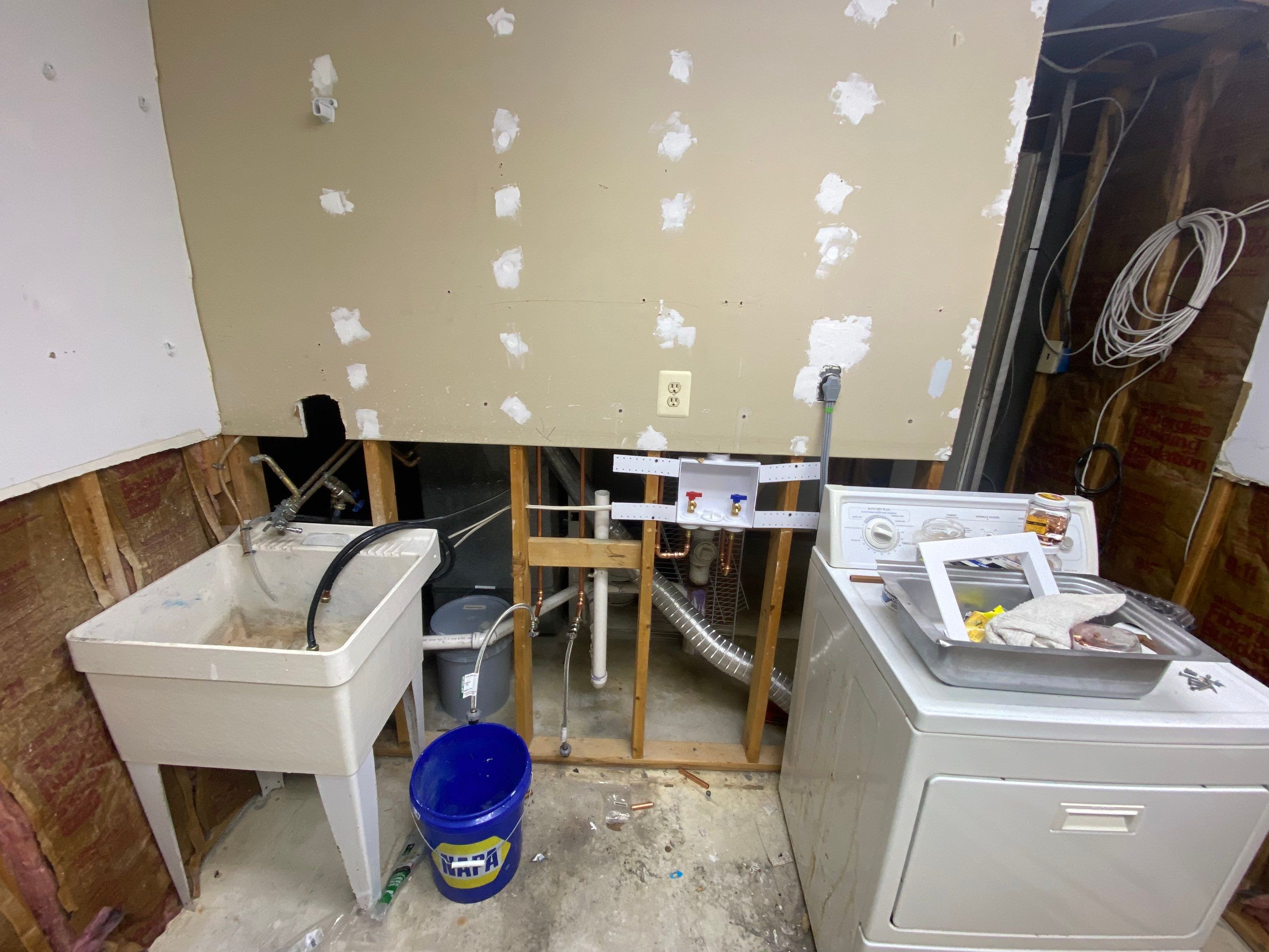 Laundry Room Redmodel using Lifeproof Luxury Vinyl Plank Flooring by The Smet Companies, LLC