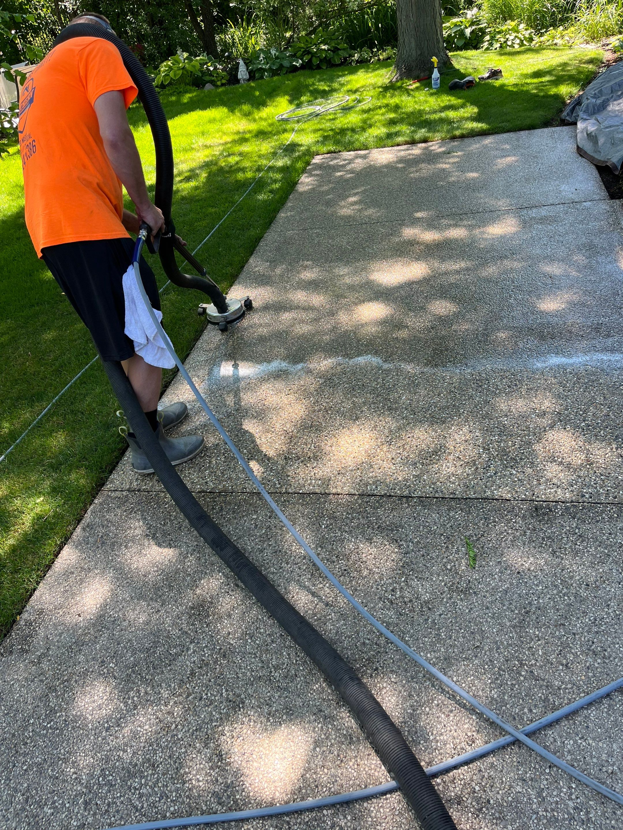 Aggregate concrete cleaning and sealing using Surebond SB-9000 by Northern Power Washing LLC.