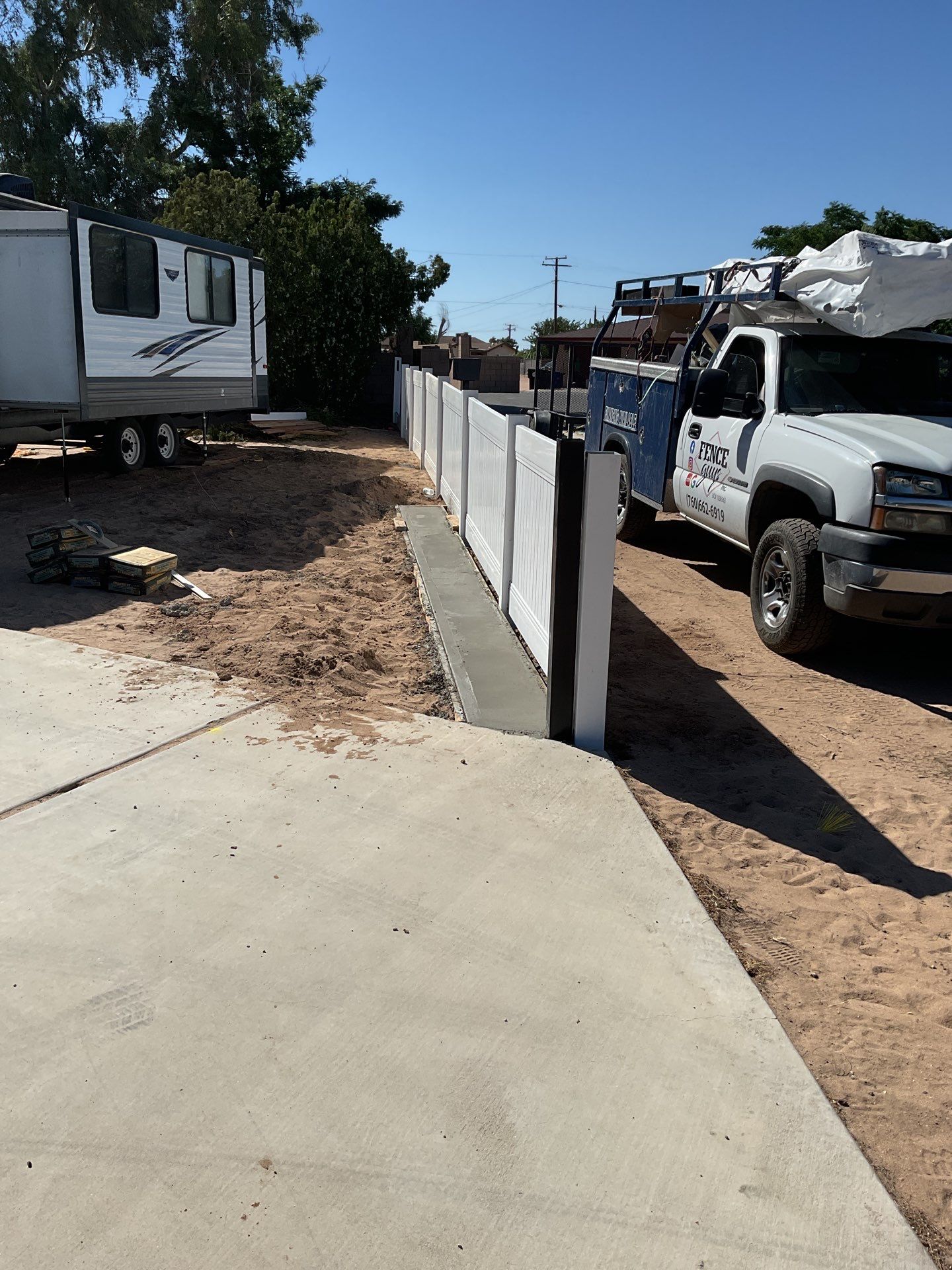 4ft White Vinyl Fence with Solar Power Motorized Gate by Fence Guys Inc.