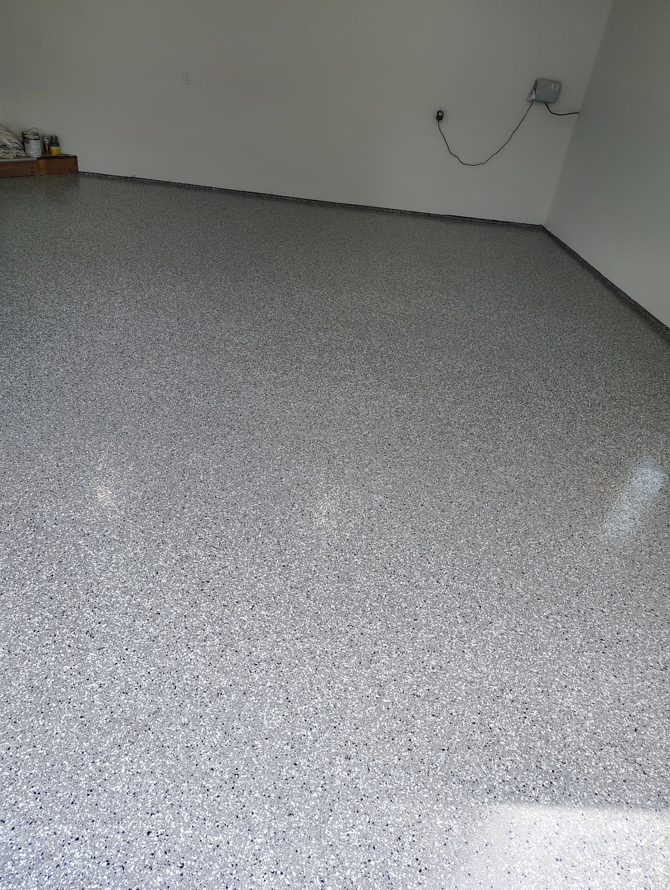 Sioux Falls Garage Floor Coating with Speckled Flake Finish by Select Painting, Coatings & Garage Cabinets