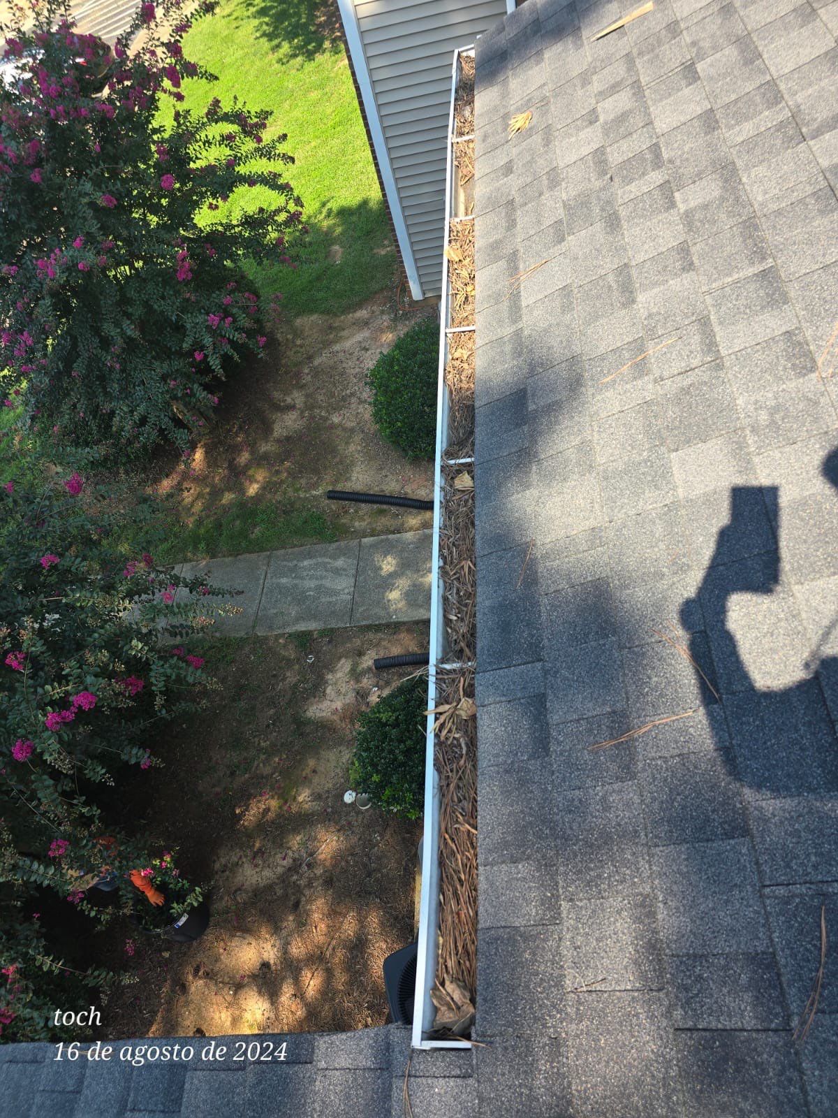 Commercial gutter cleaning High Point, NC before photo with filled gutters