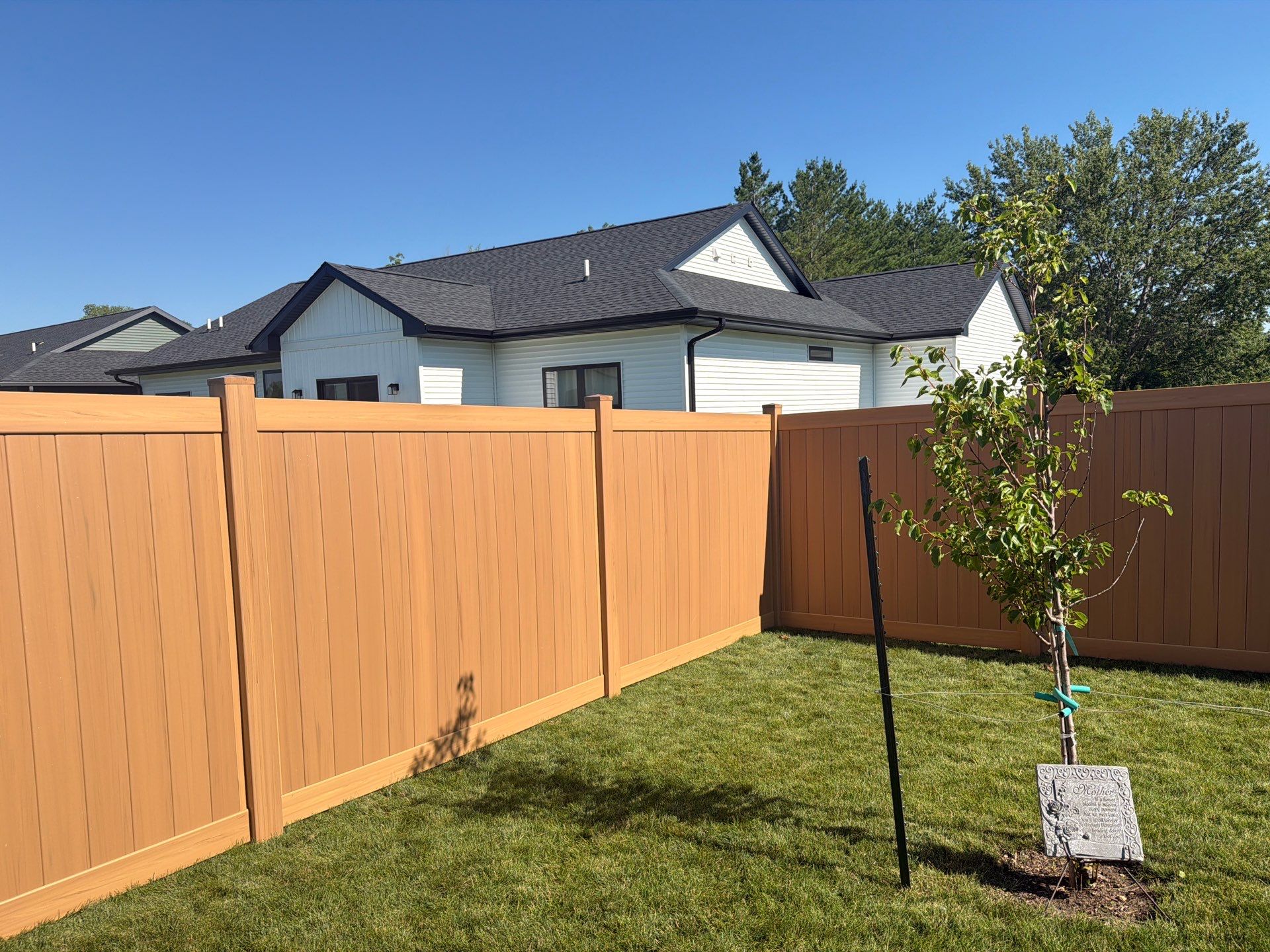 Residential Cypress Vinyl Privacy Fence Installation in Cedar Falls by Perfect Picket Fence and Stain