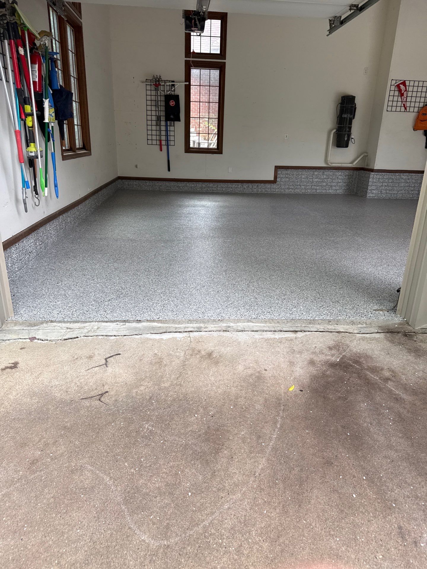 Coyote Flake Epoxy Garage Floor Coating in Earlham by Revival Concrete Coatings