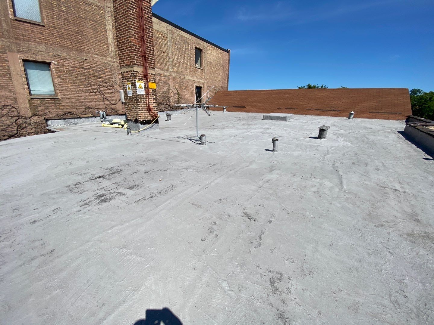 Asphalt Roof Replacement with Aluminum Gutter Installation by Custom Installations