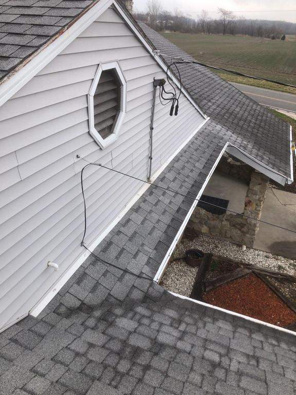 Storm damage roof replacement by Nitro Roofing and Construction