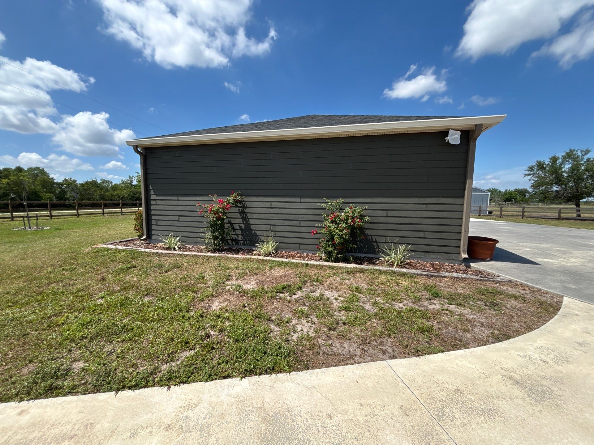  7-inch White seamless gutters and downspouts in Myakka City FL by Gutter Professors