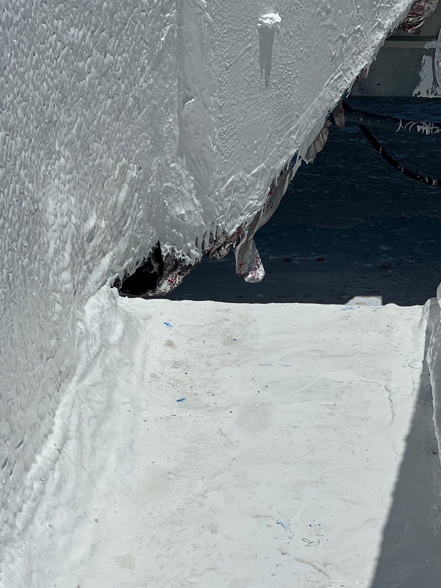 Dirty leaking Gravel Roof by Bayfront Roofing and Construction