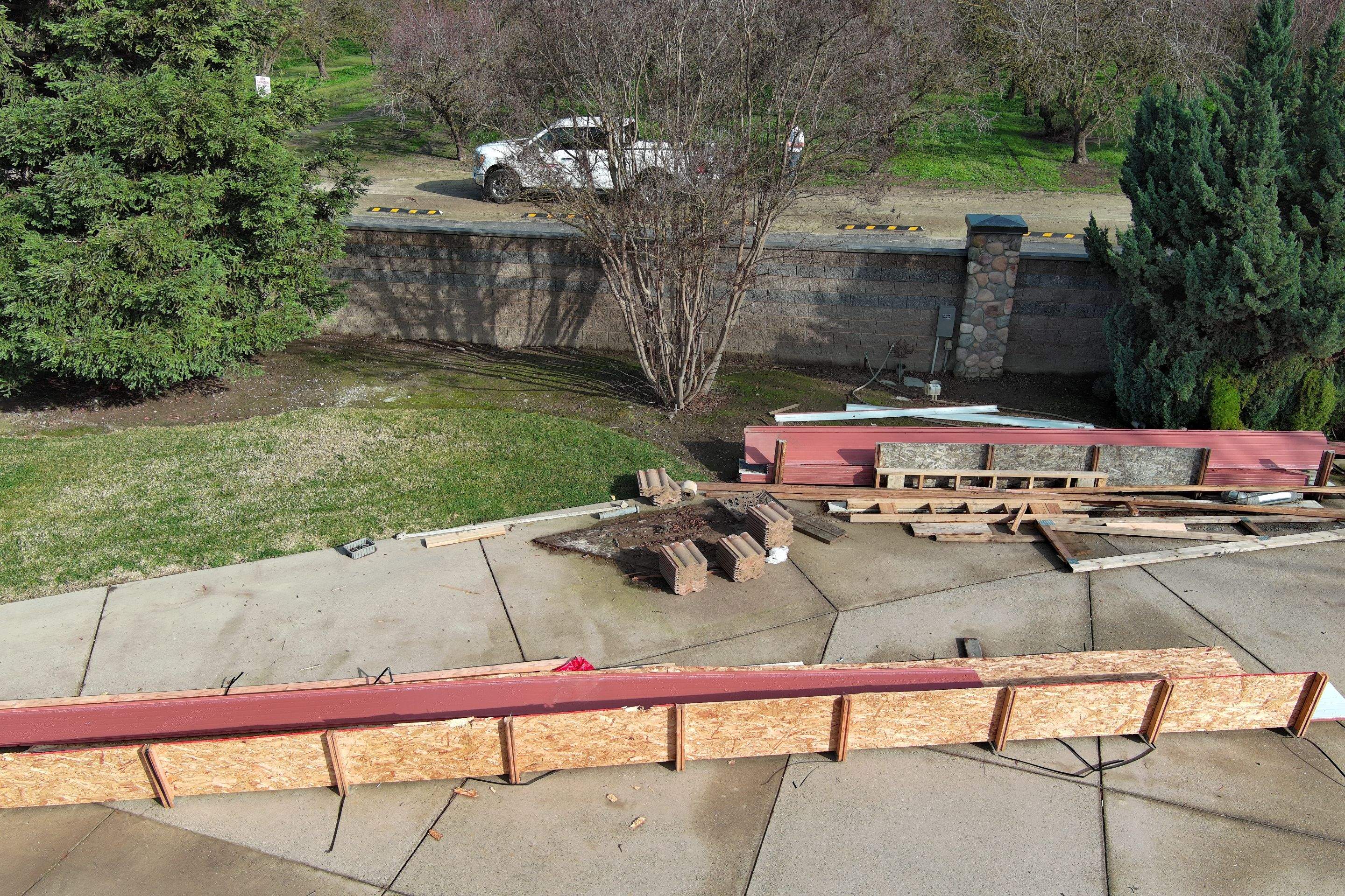 Tile, Metal, and TPO roofing project (new construction) by Straight Edge Roofing Inc