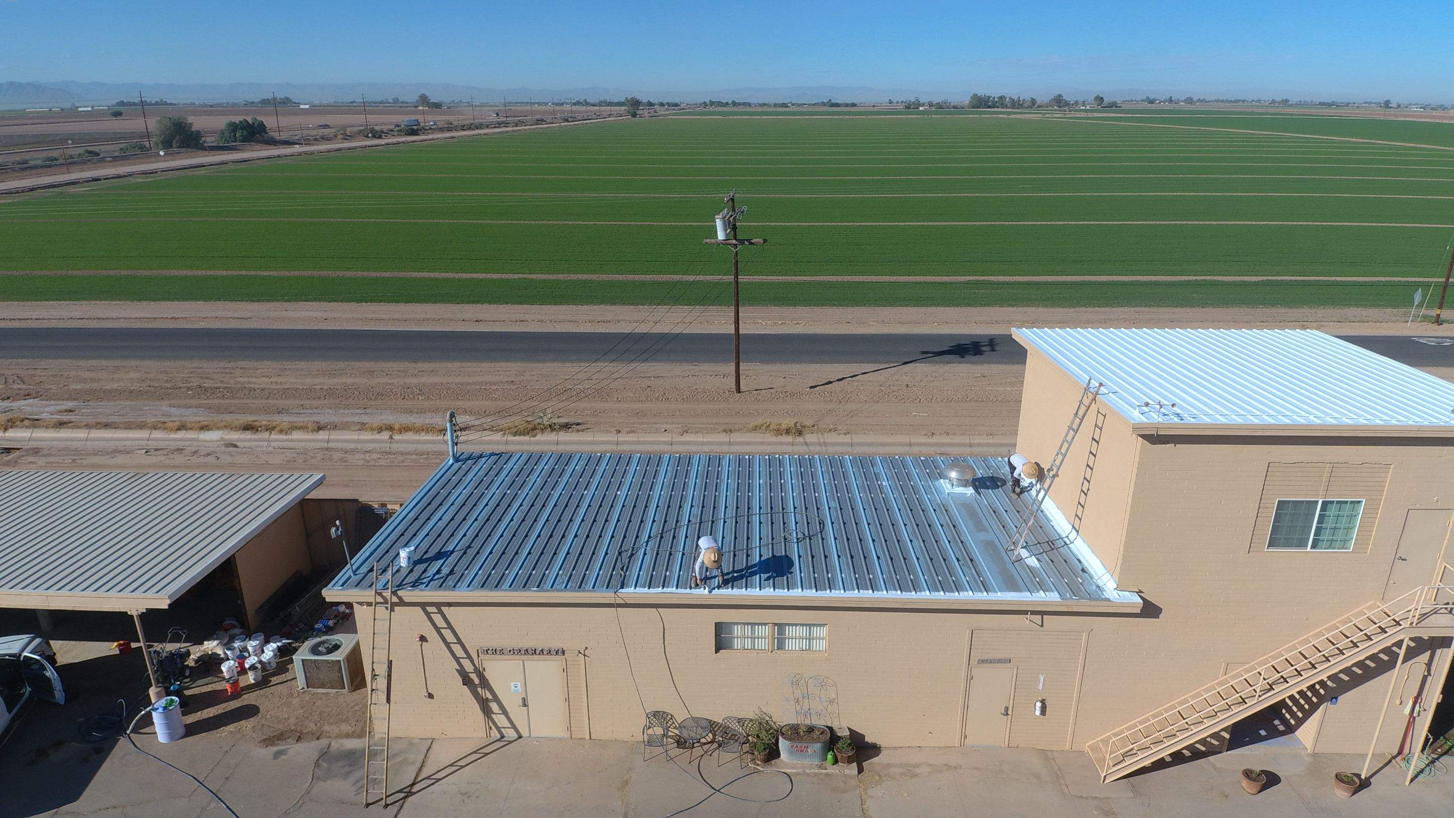 Metal roof restoration on commercial roof using Conklin Benchmark/PUMA XL fabric and coating by Straight Edge Roofing Inc