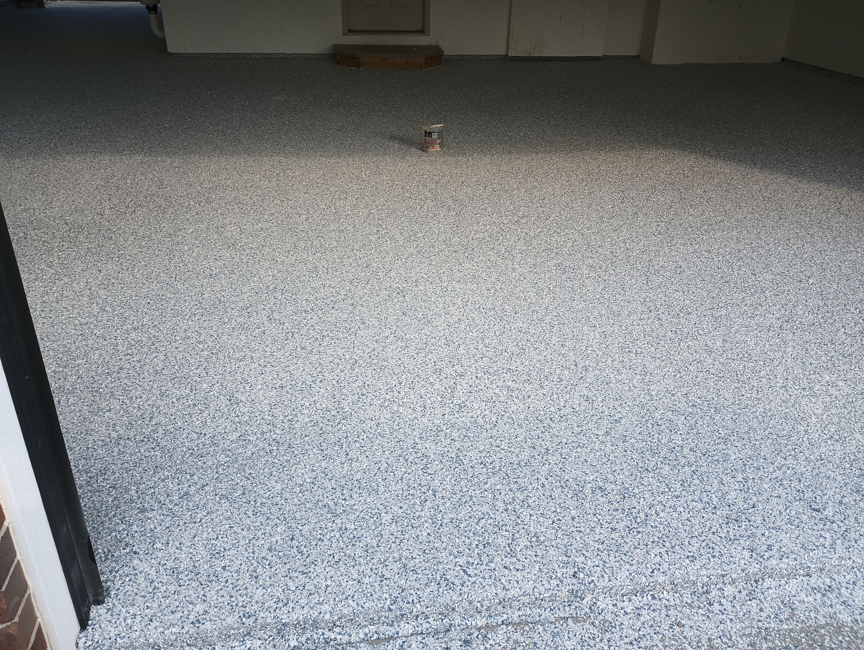 Garage Concrete Coating Installation in Sioux Falls Using Tidal Wave Finish by Select Painting, Coatings & Garage Cabinets