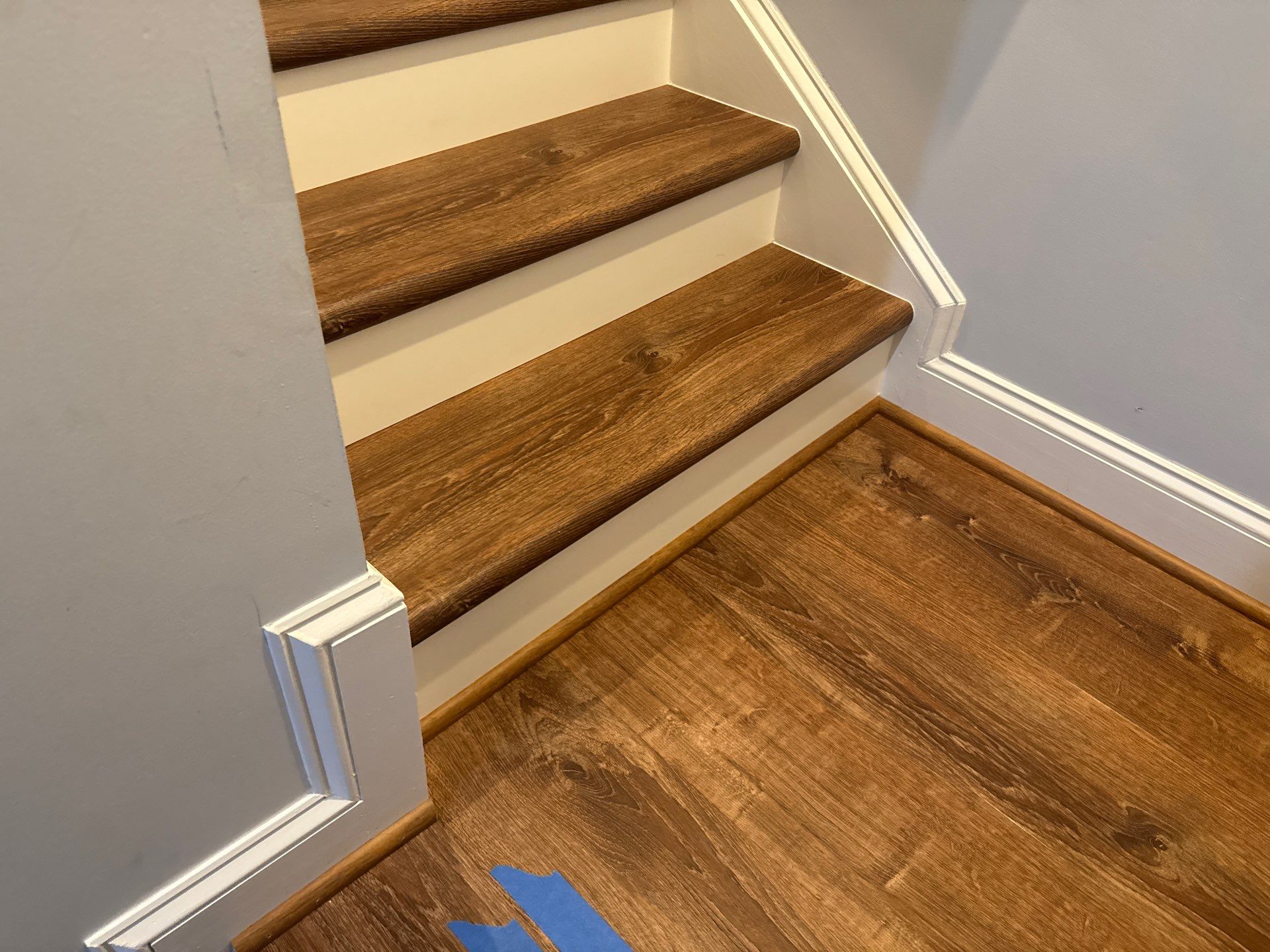 Stairway Installation using t vinyl stair tread and reversibleriser by La Bendicion Contruction Llc