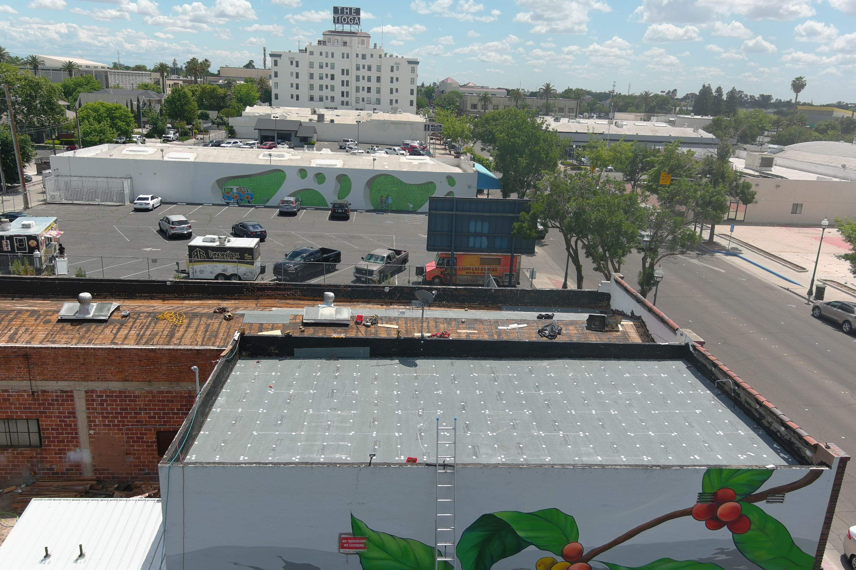 Commercial Roofing Installation using Conklin BenchPly system with PUMA top coat (imbedded fabric system) by Straight Edge Roofing Inc