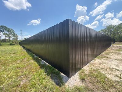 Black Scalloped Metal Privacy Fence Installation in Punta Gorda