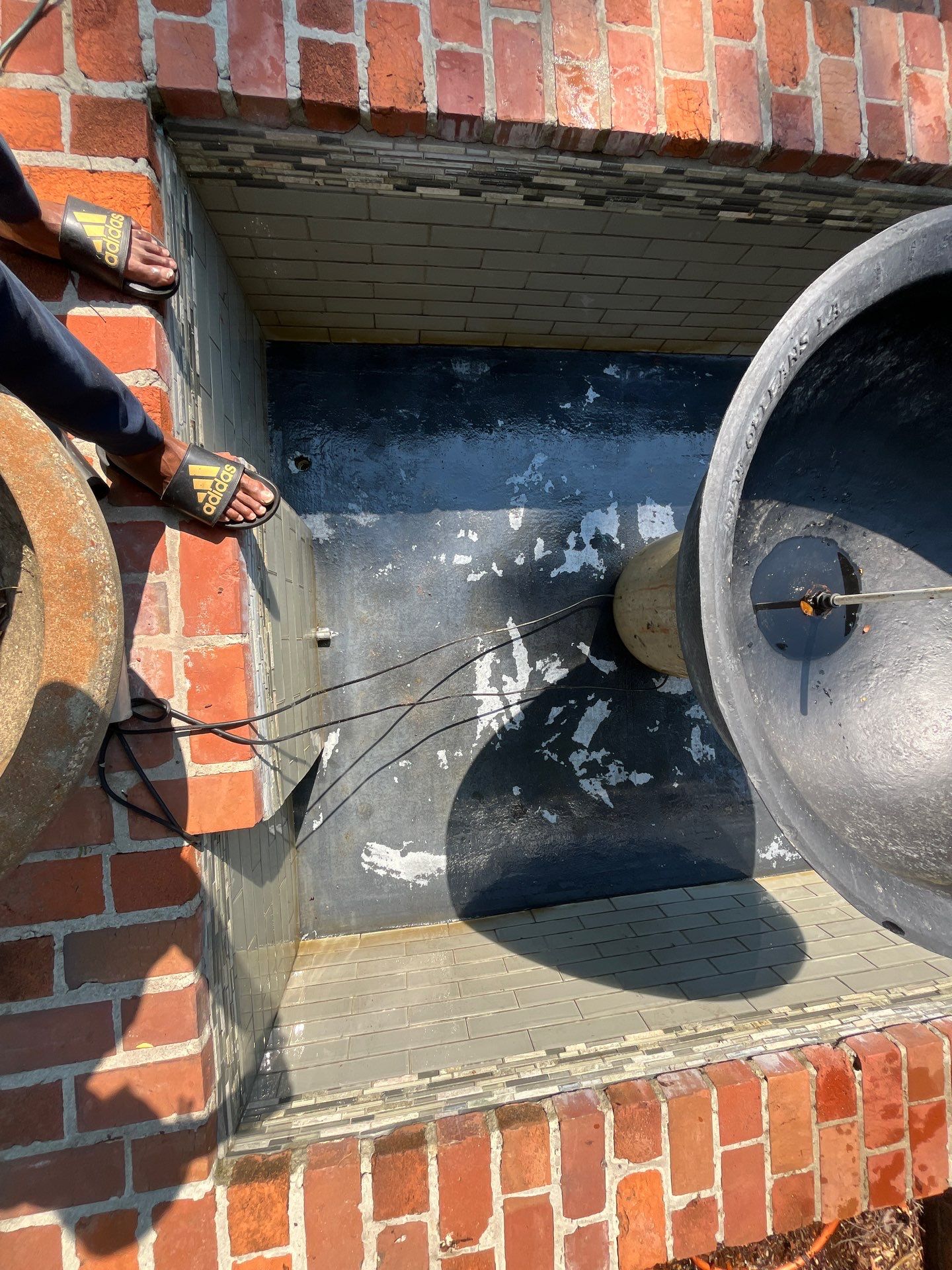 Pool Cleaning using Pool Cleaner by College Bros Outdoor services