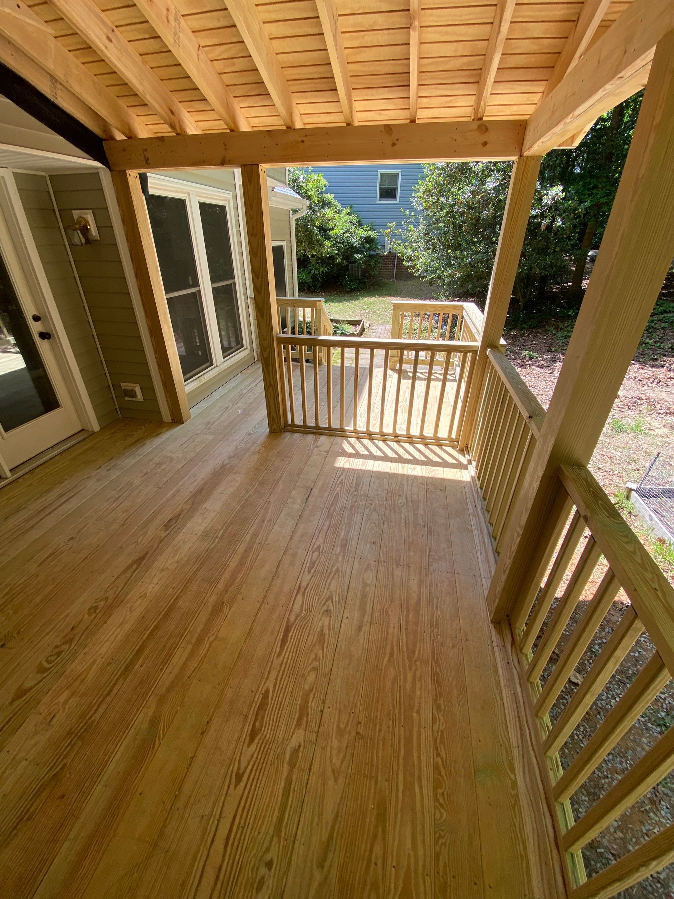Custom Screen Porch Addition with Gabled Roof and Open Deck by The Remodeling Company