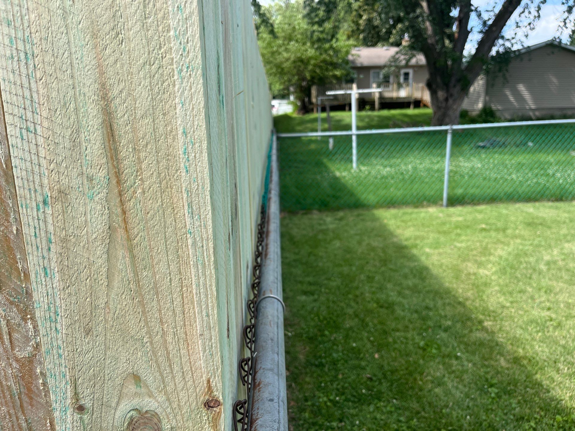 Custom Treated Pine Privacy Fence and Chain Link Installation in Cedar Falls by Perfect Picket Fence and Stain