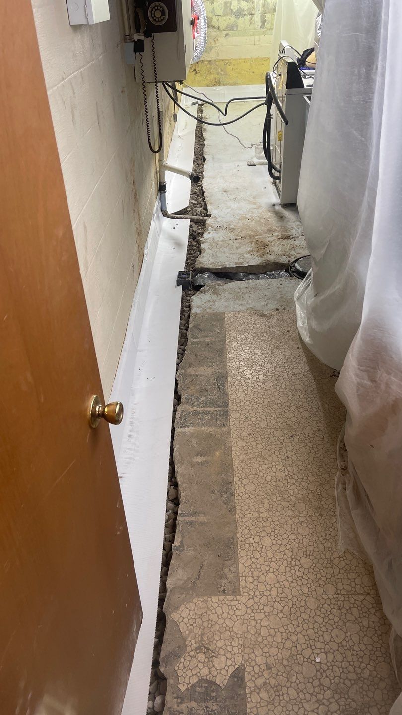 Interior Waterproofing Using GrateDrain™ Products by Toledo Basement Repair