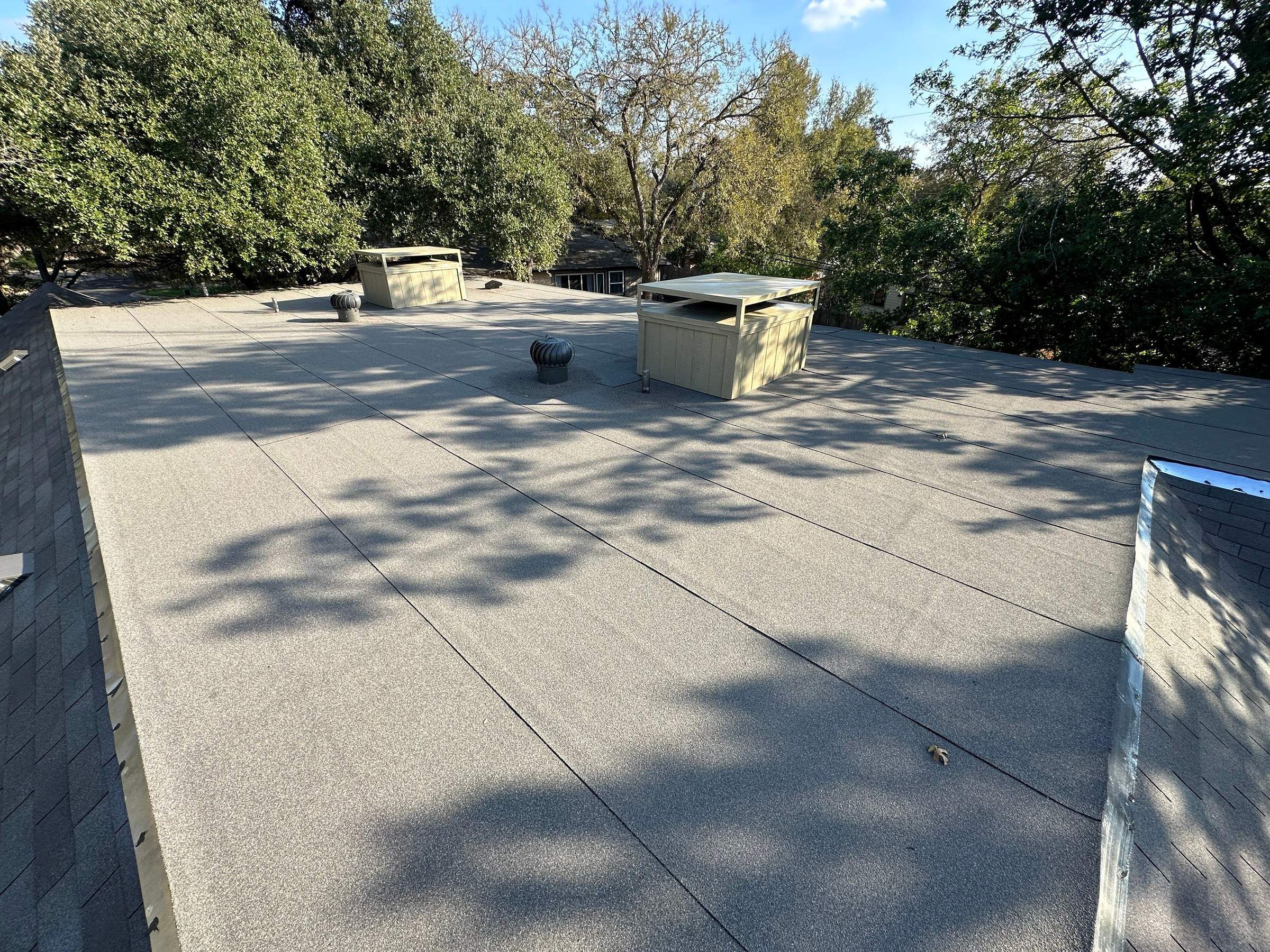 Driftwood Shingles and Low-Slope Roofing in Austin by Skywall Construction LLC