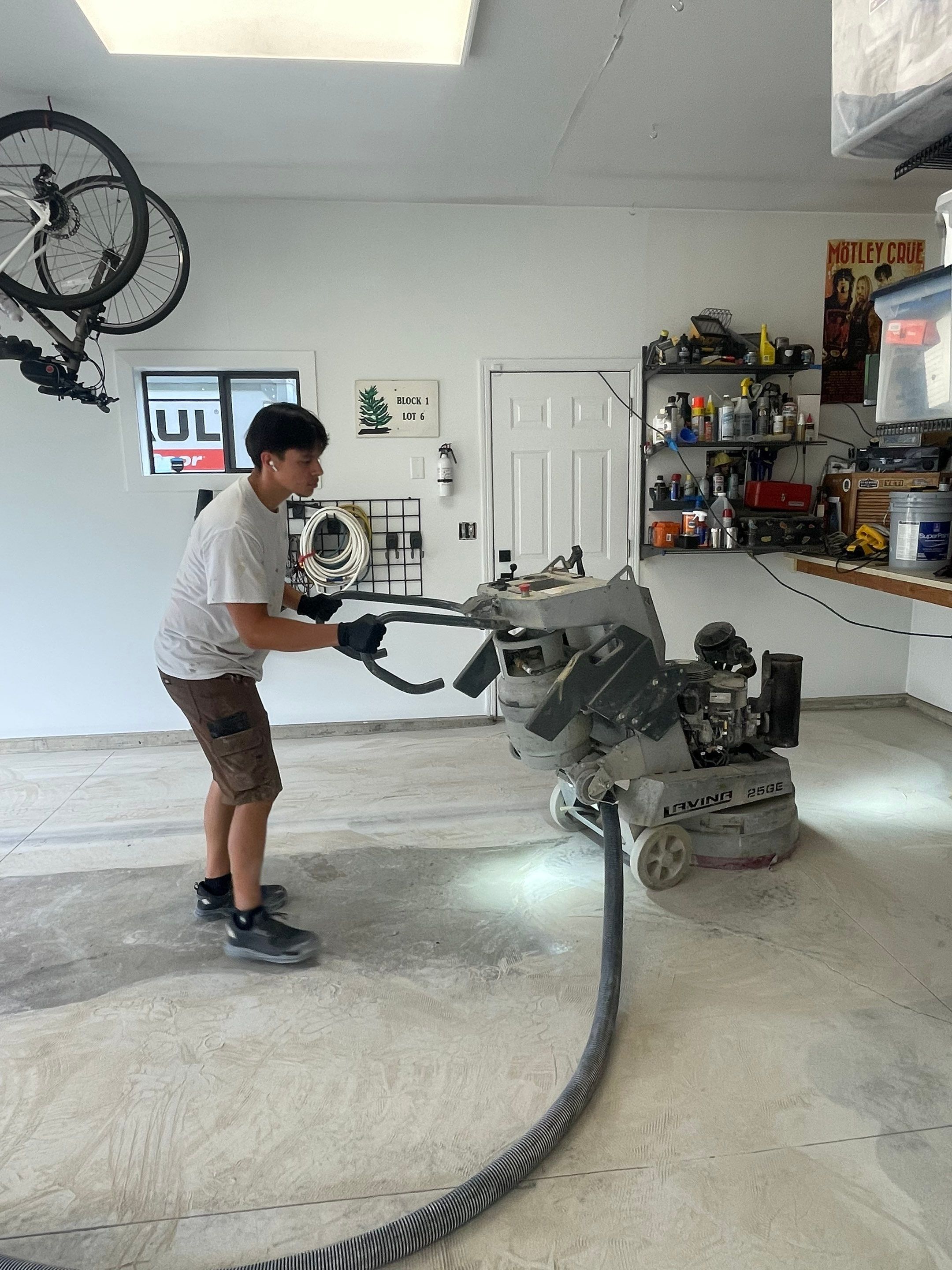 Feather Grey Garage Floor Coating Installation in Sioux Falls by Select Painting, Coatings & Garage Cabinets