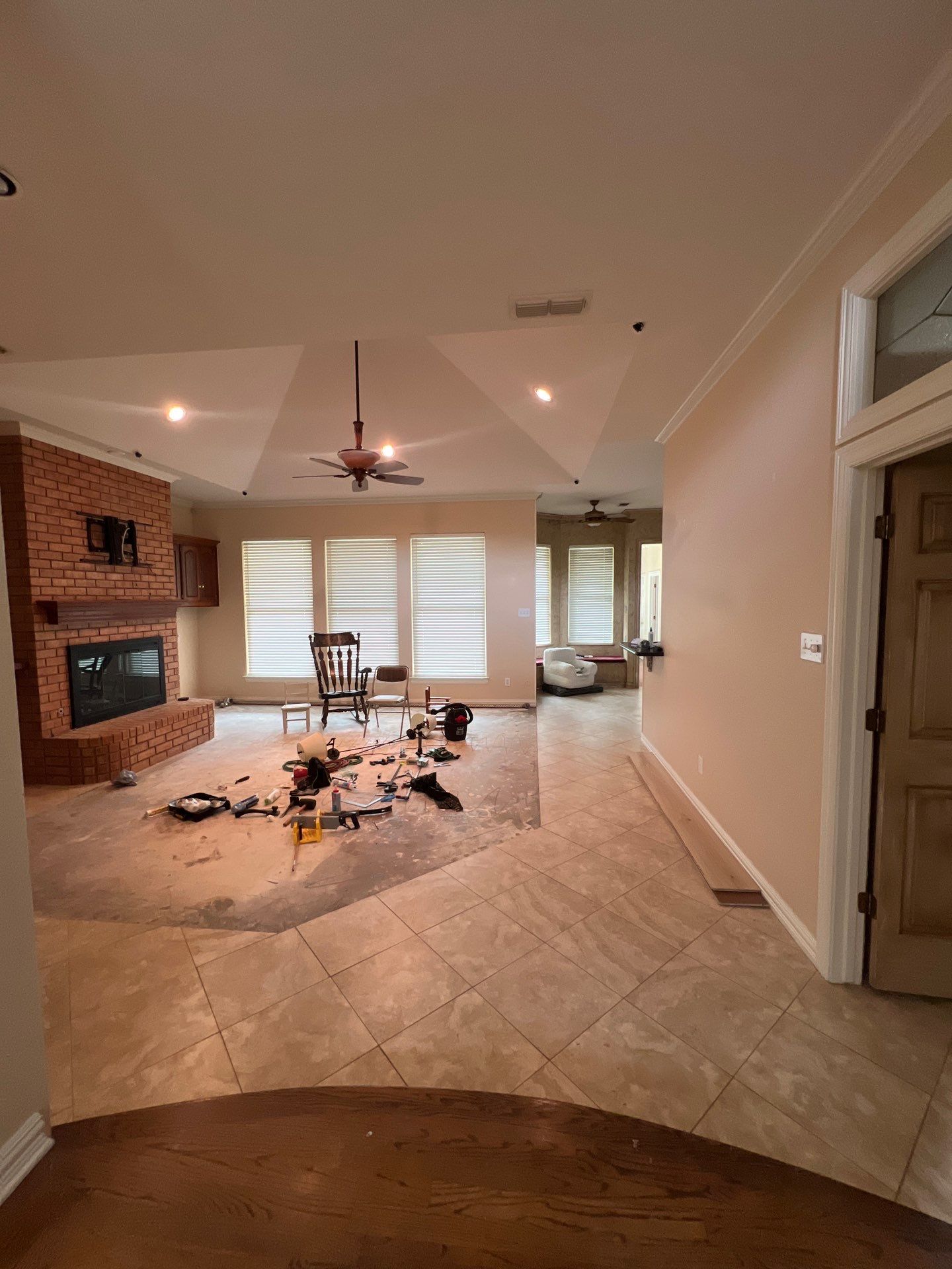 Wide-Plank Wood Flooring Replacement and Custom Herringbone Entryway by Simmons Floors 