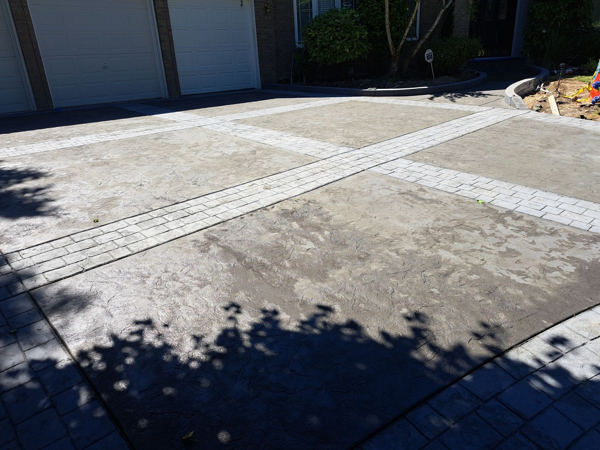 Multi-color Stamped & Sealed Concrete Driveway Renovation | Mukilteo by Jireh Asphalt & Concrete Inc