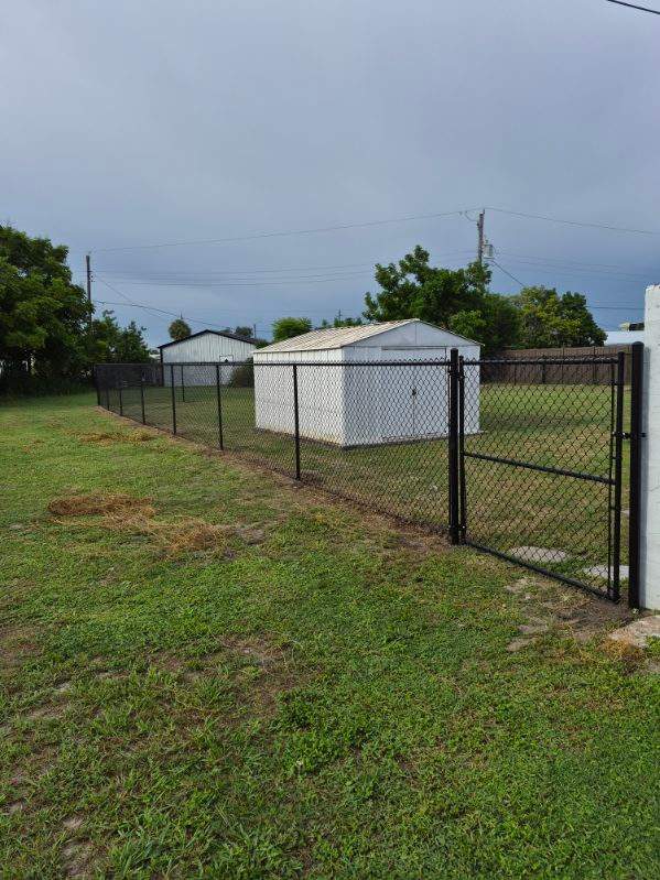 Black Chain Link Fence Installation for Residential Backyard in Port Charlotte by True Fence LLC