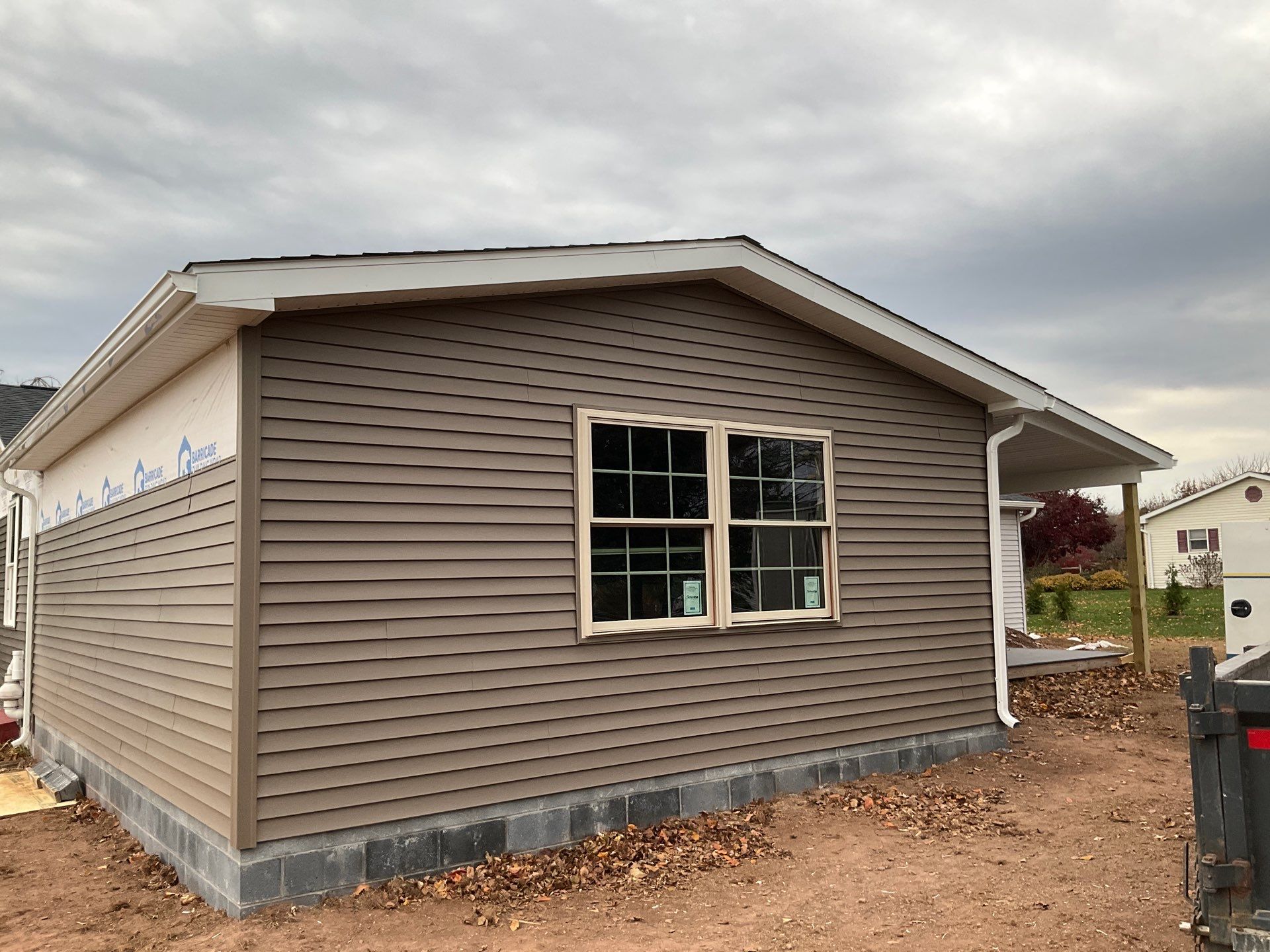 Residential Addition and Covered Porch Roof  by Esh Builders