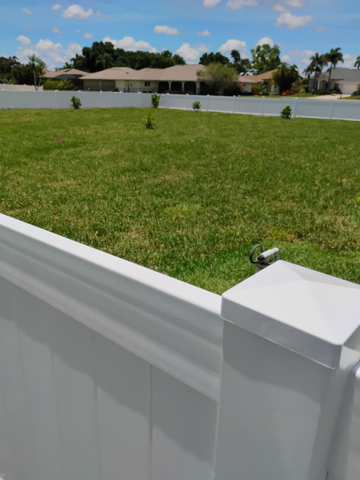 White Vinyl Privacy Fence Installation on Port Charlotte Corner Lot by True Fence LLC