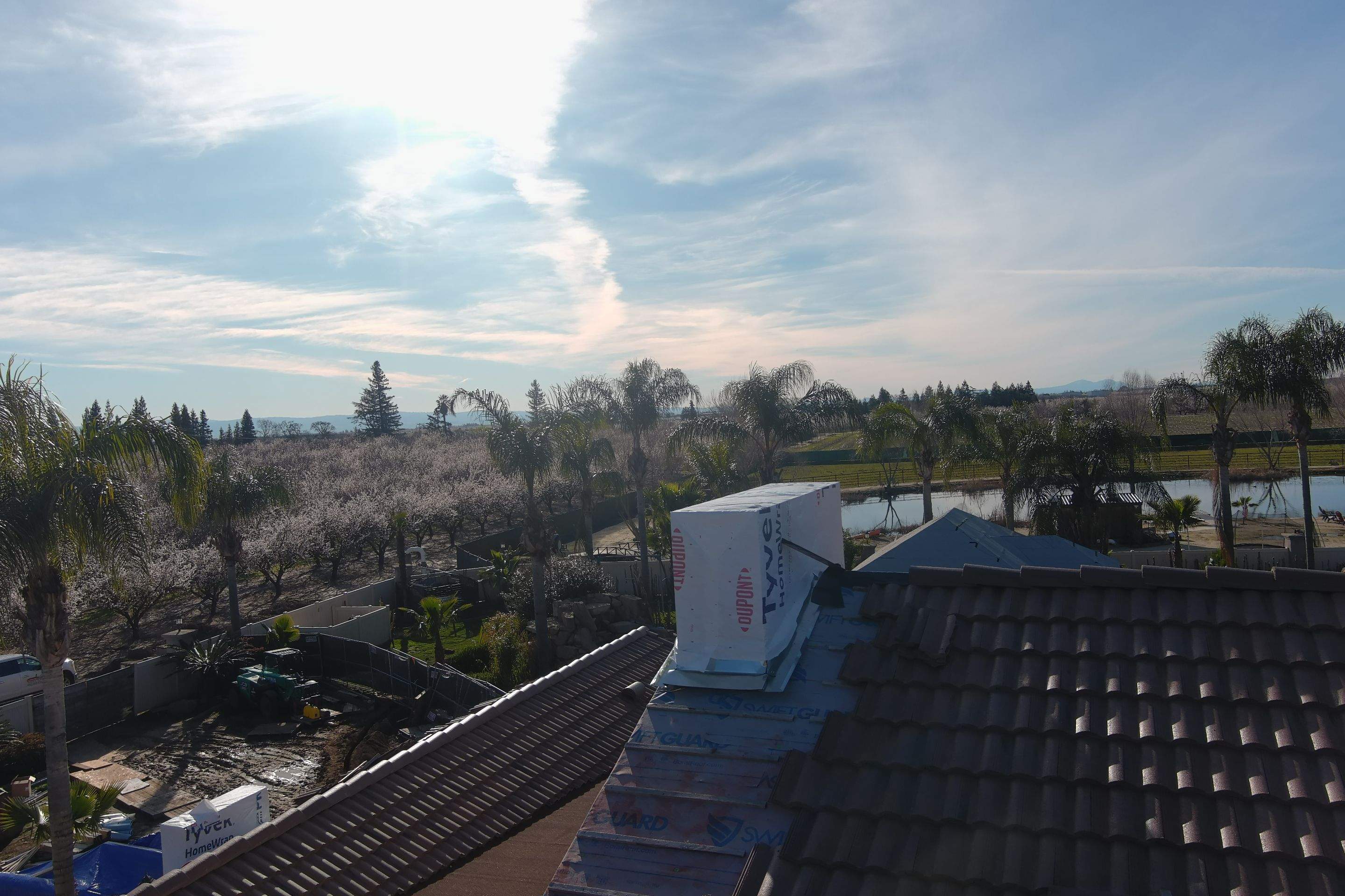 Tile, Metal, and TPO roofing project (new construction) by Straight Edge Roofing Inc