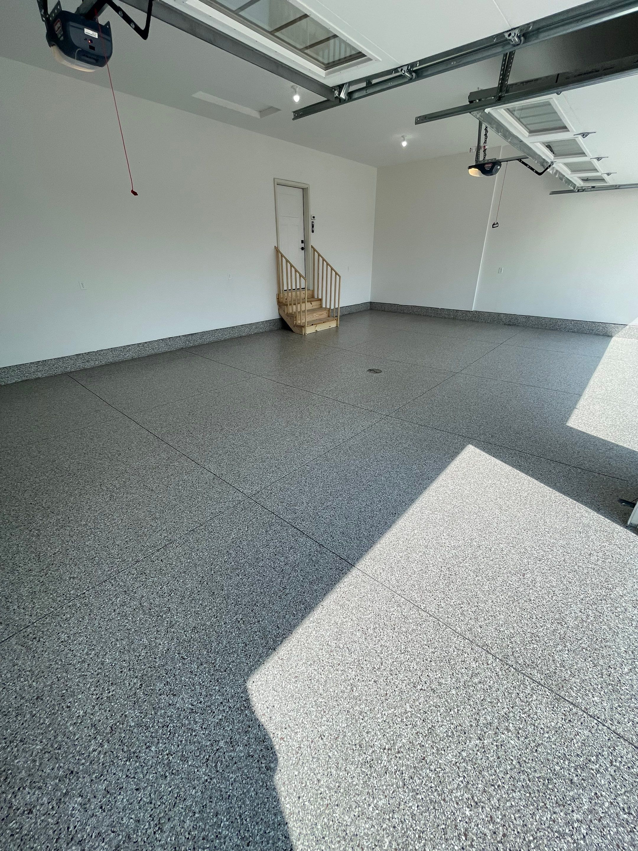 Grey Speckled Garage Floor Coating in Sioux Falls by Select Painting, Coatings & Garage Cabinets