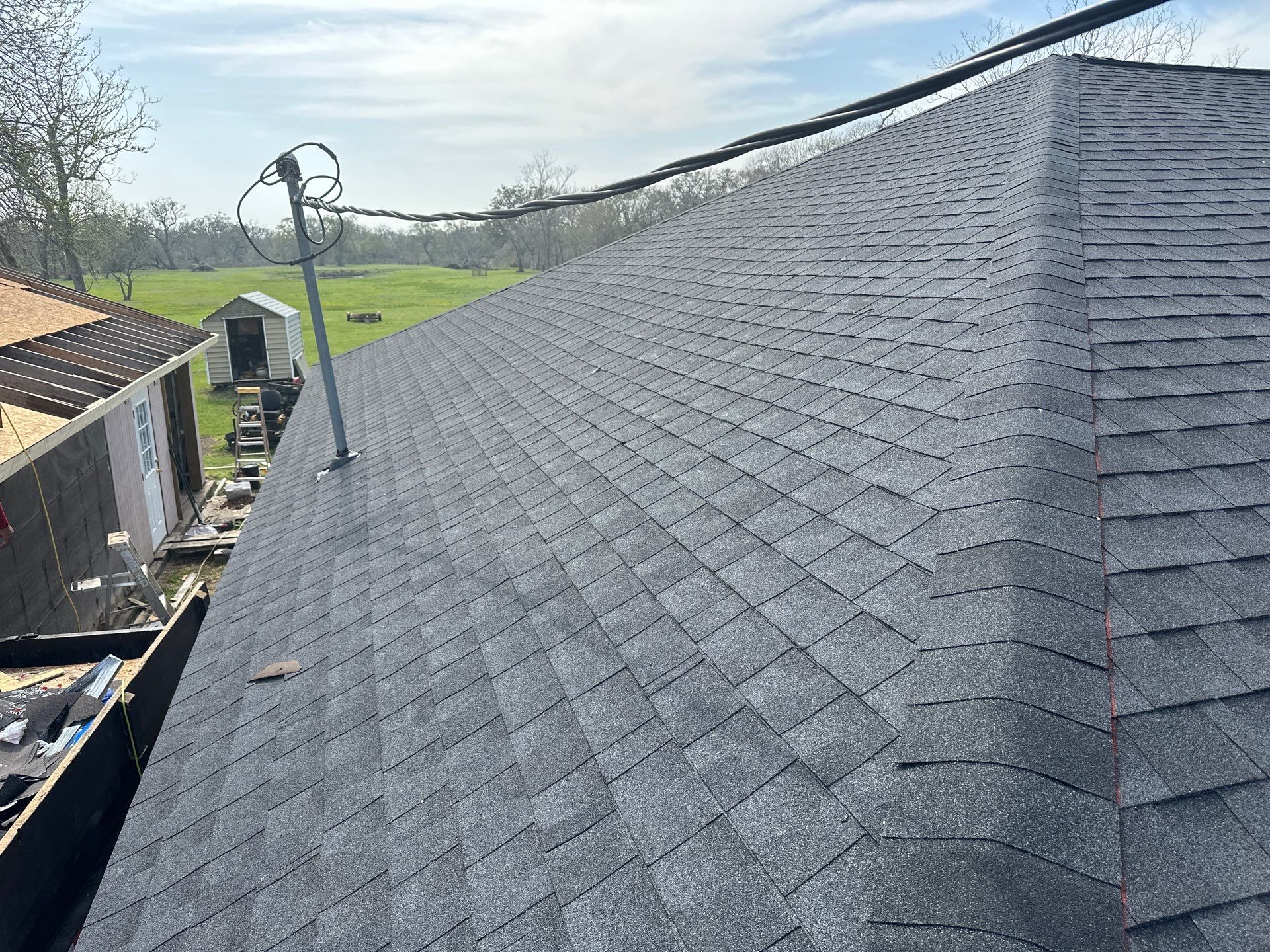 Residential Roofing Installation using GAF Timberline Night Shadow (NS) by Motion Roofing
