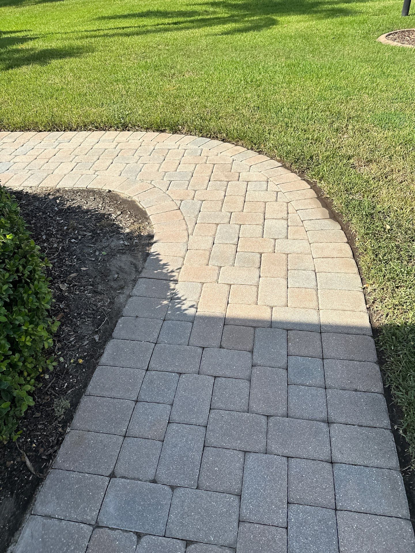 Paver Driveway, Entryway, Sidewalk, and Street Curbing Cleaning in Winding River Community, Bradenton, FL by Sunshine AquaWash