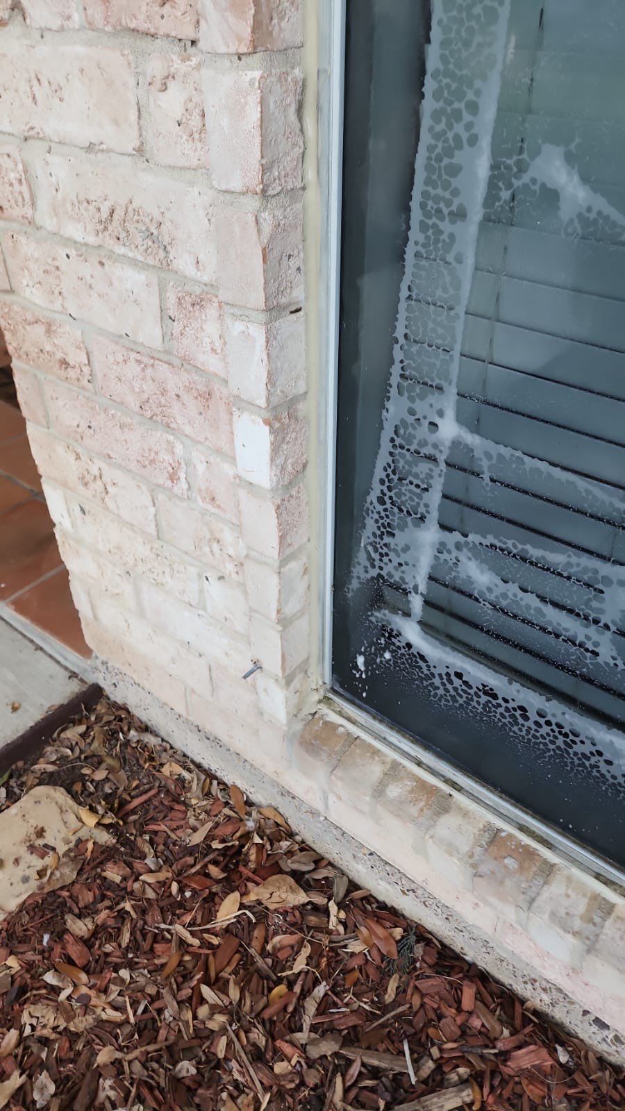 Colored Vinyl Windows to blend into brick by Bayfront Roofing and Construction