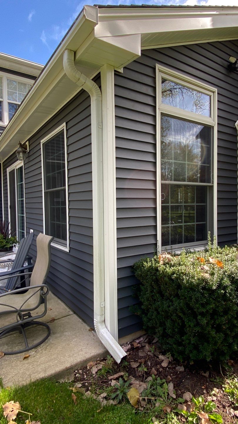 Asphalt Roof Replacement with Aluminum Gutter Installment by Custom Installations