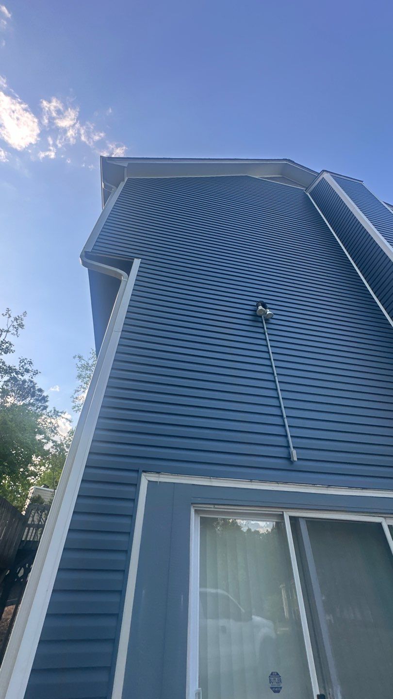 Blue Vinyl Siding Replacement and Exterior Trim Update in Durham by The Remodeling Company