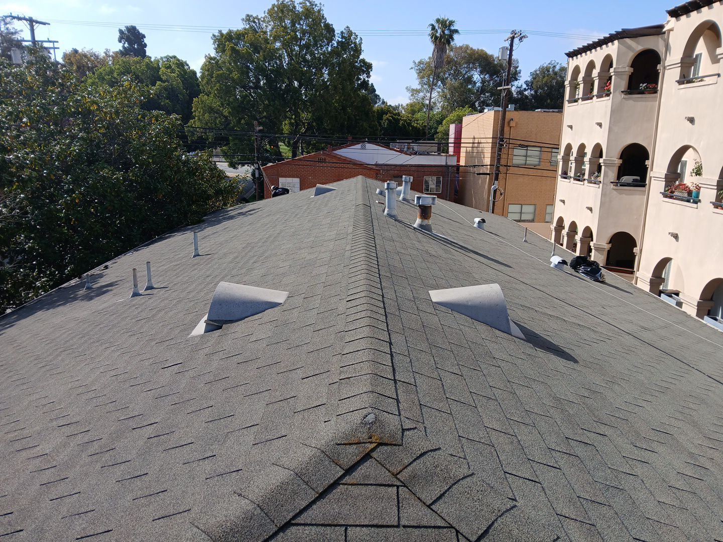 Apartment Building 2nd Layer Installation &Silicone coating by Hull Brothers Roofing