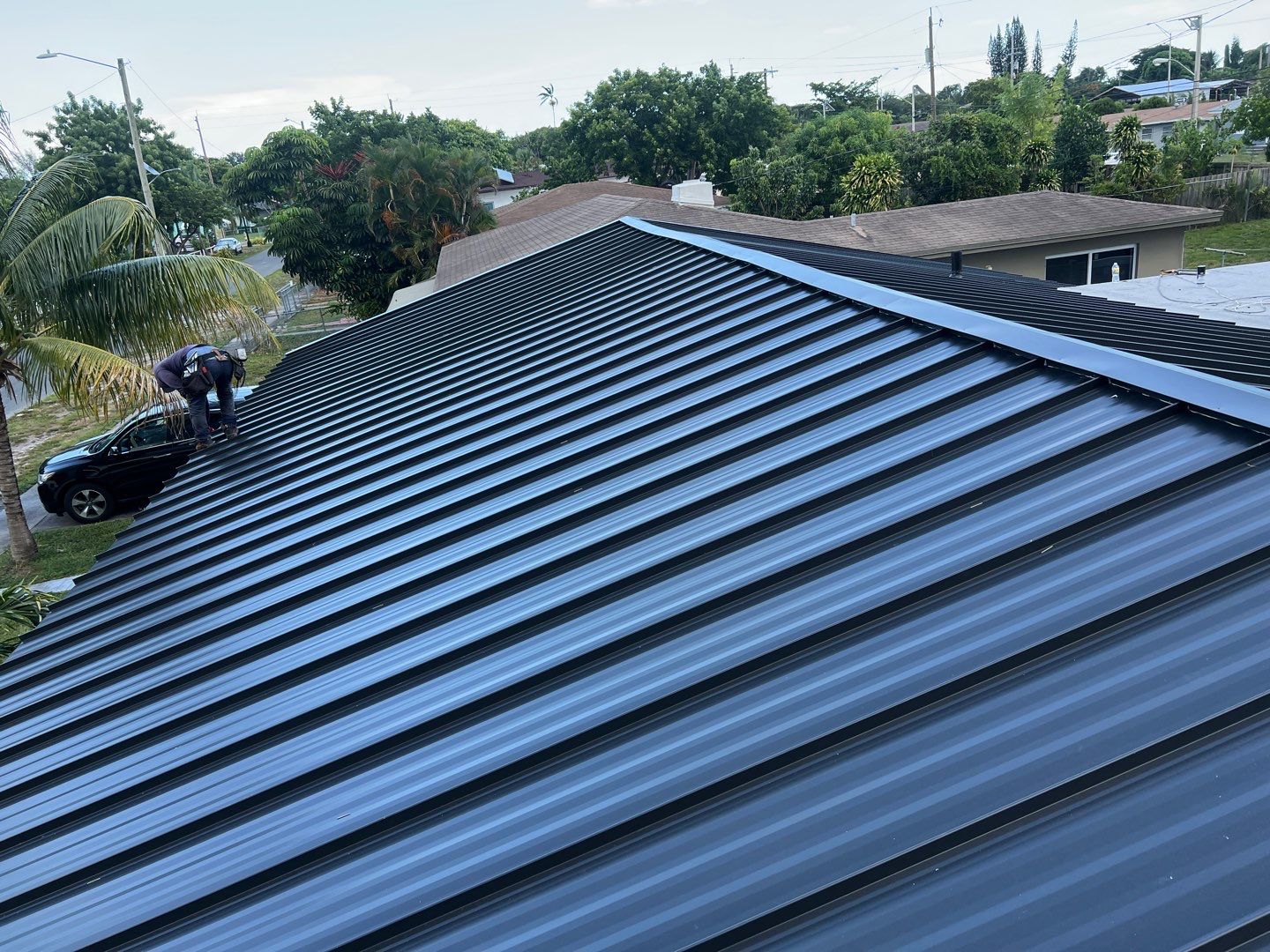 Standing Seam Metal & Flat Re-Roof using 1.5" Nail Strip 24ga Black Matte Kynar Coated Standing Seam Metal Panels by Morton Roofing, Inc.