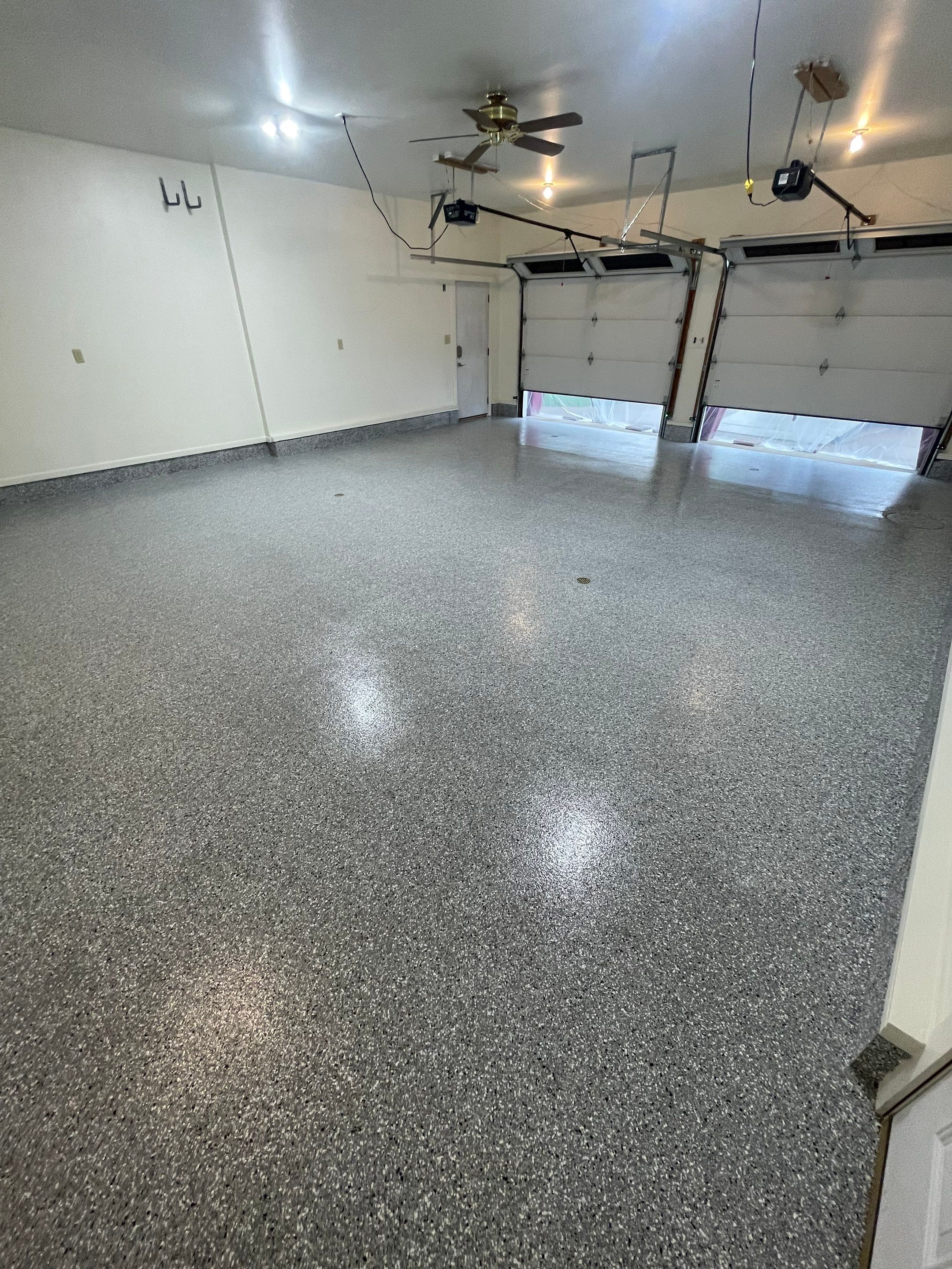 Madison Garage Concrete Coating with Feather Grey Speckle Finish by Select Painting, Coatings & Garage Cabinets