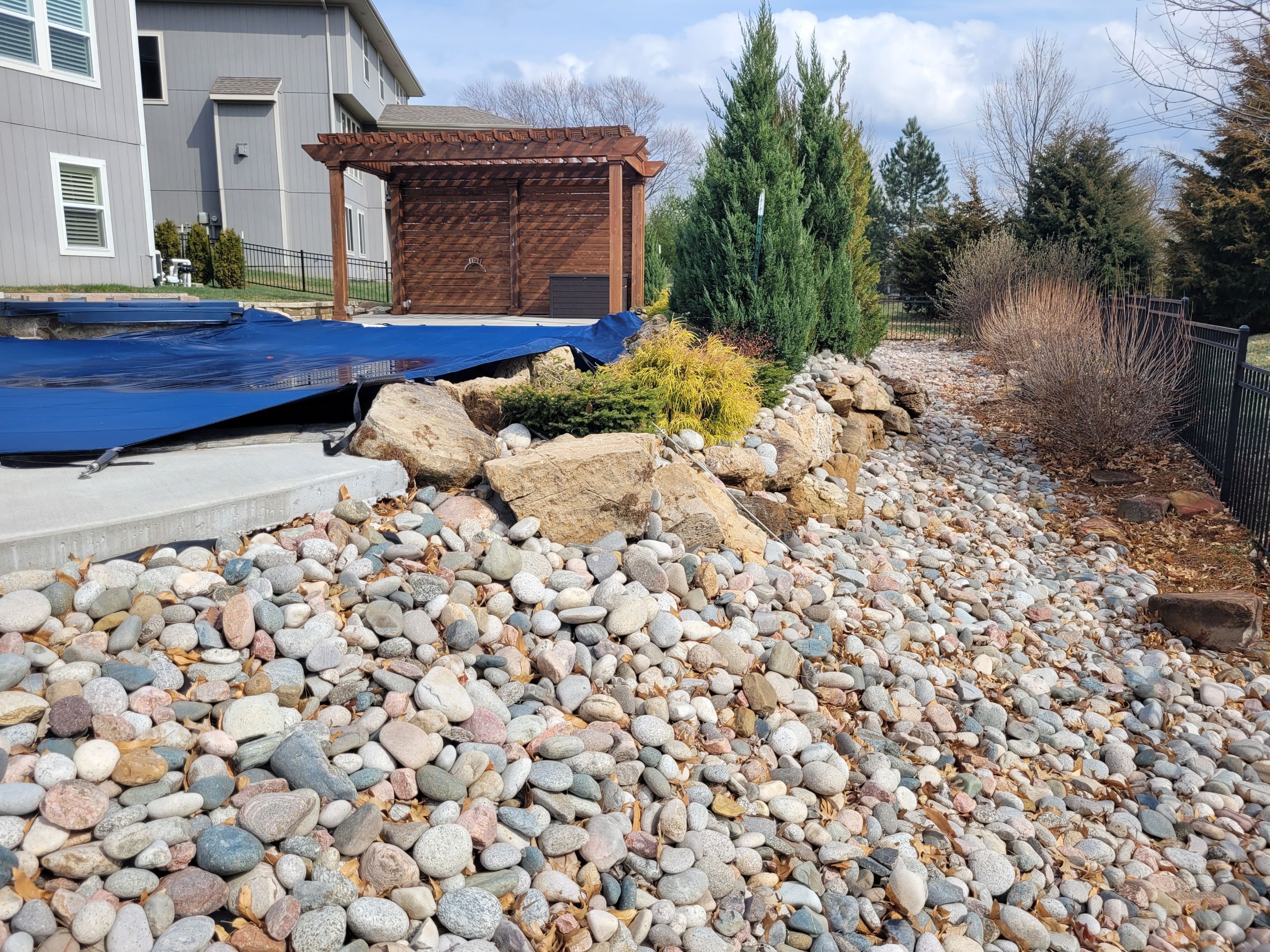 Pool Retaining Wall by LAND ESCAPES LLC