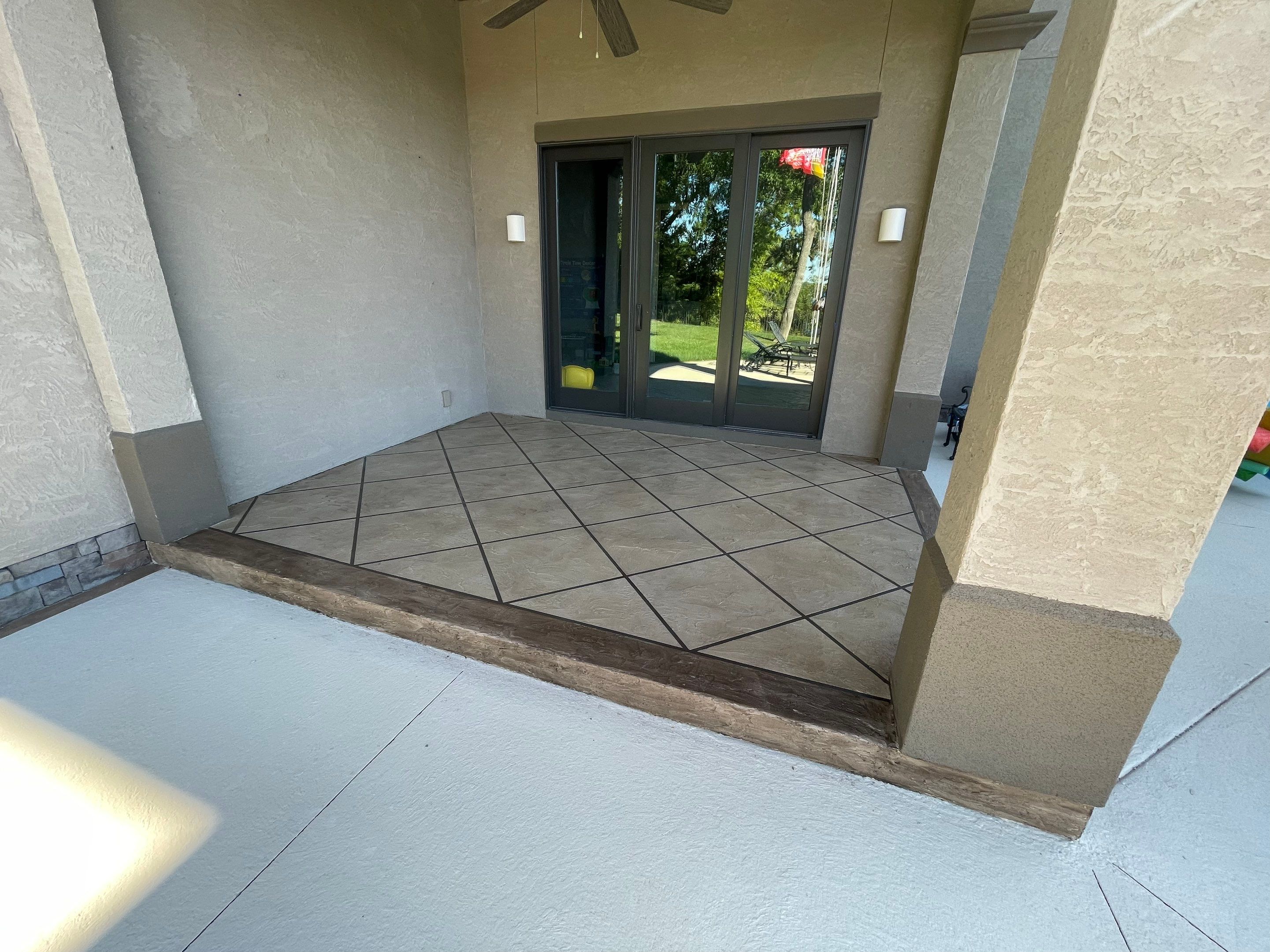 Lake Lotawana -- Front Walkway and Back Patio Tuscan Overlay by Big Red Decorative Concrete, LLC