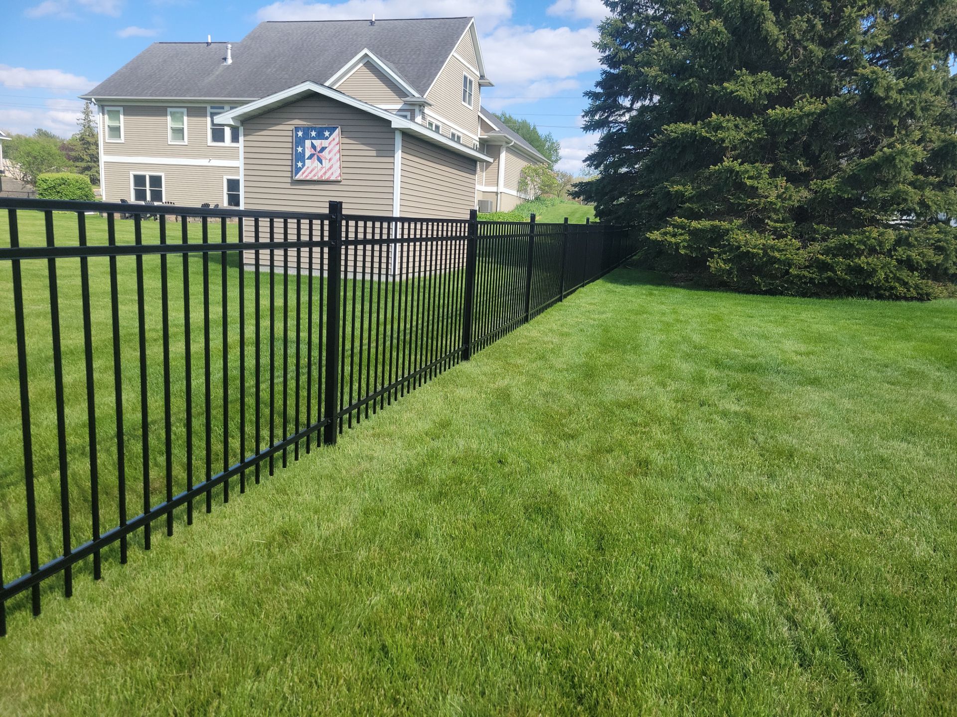 Black Ornamental Metal Picket Fence Installation in Waterloo by Perfect Picket Fence and Stain