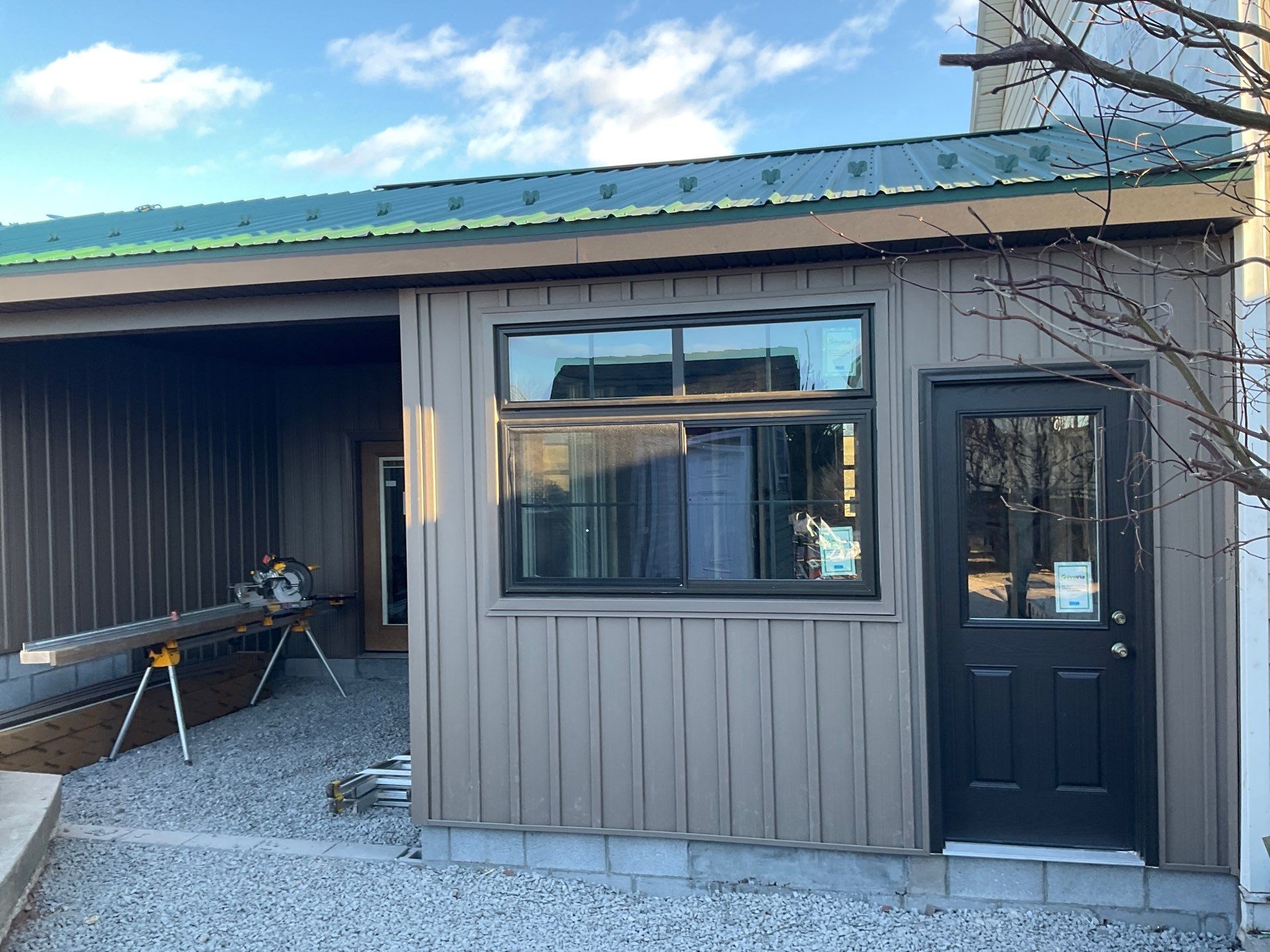Multi-Story Residential Addition Featuring Textured Metal Siding in Millersburg by Esh Builders