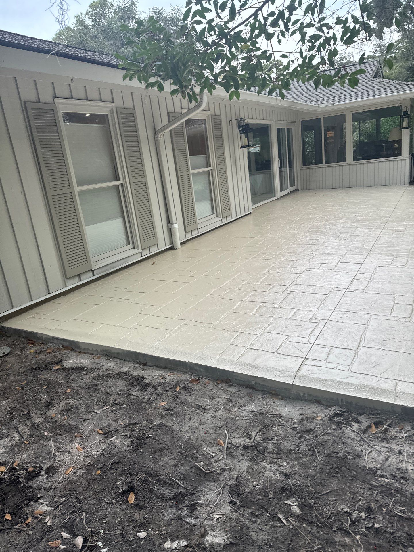 Ashlar Slate Stamped Concrete Patio Installation in Hilton Head Island by Lowcountry Scapes, LLC