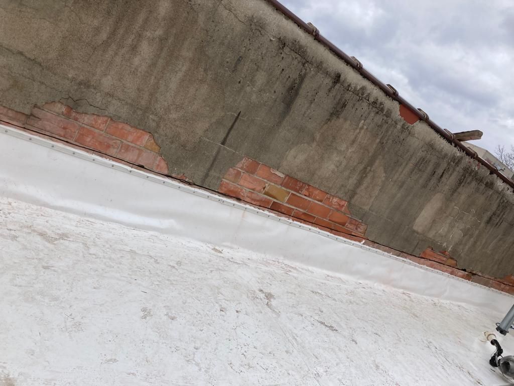 Roof Recover on a downtown building in Lake City  by Grell Roofing, LLC